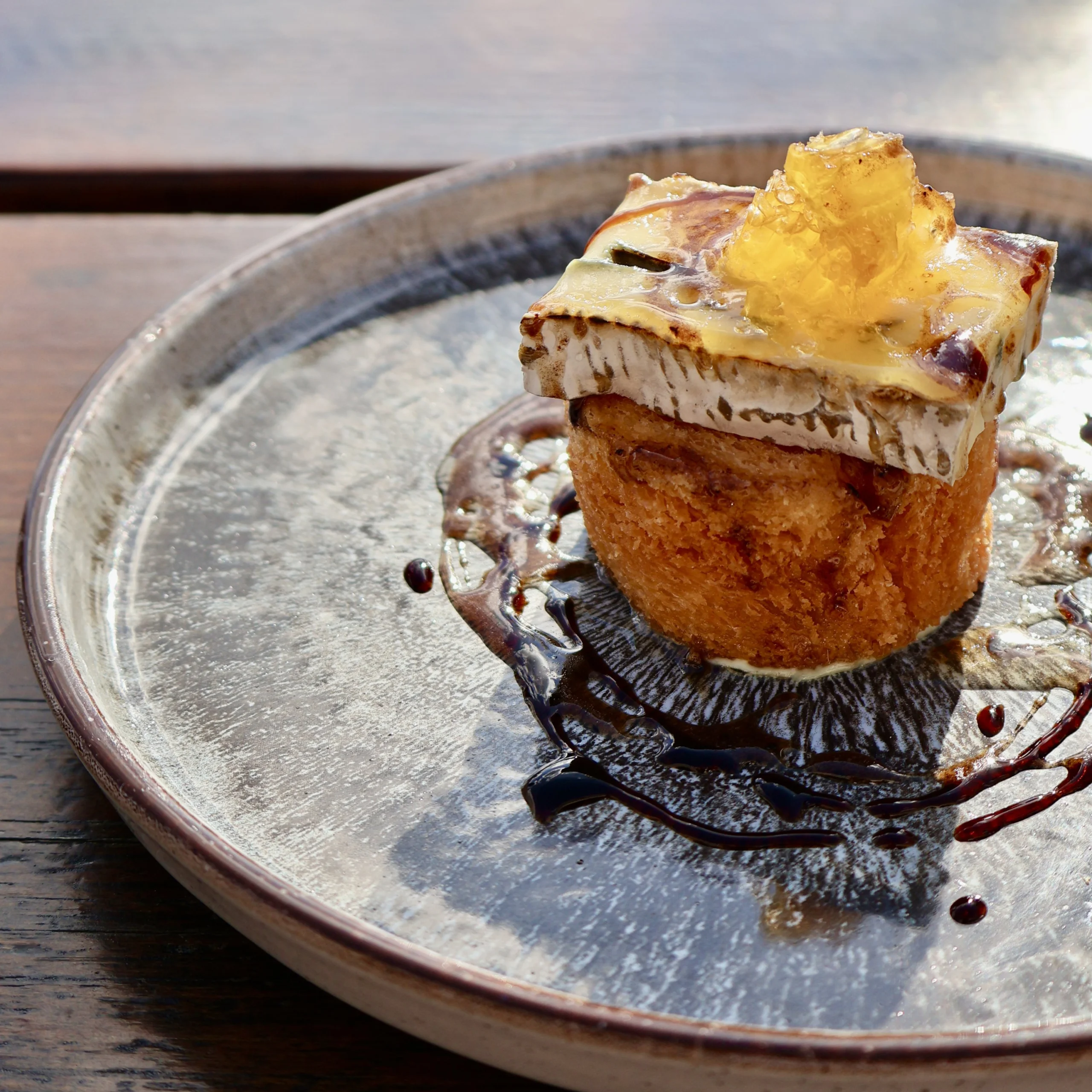 brioche topped with blue cheese on a plate at doddington grain store