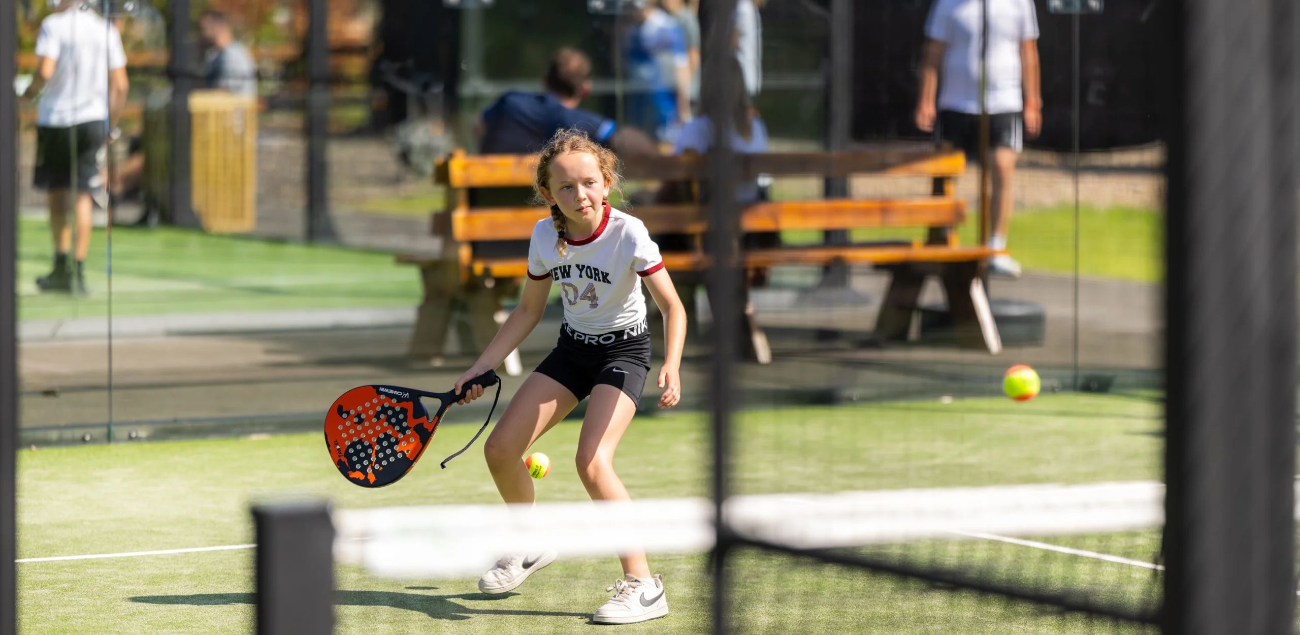 girl playing padel at doddington hall