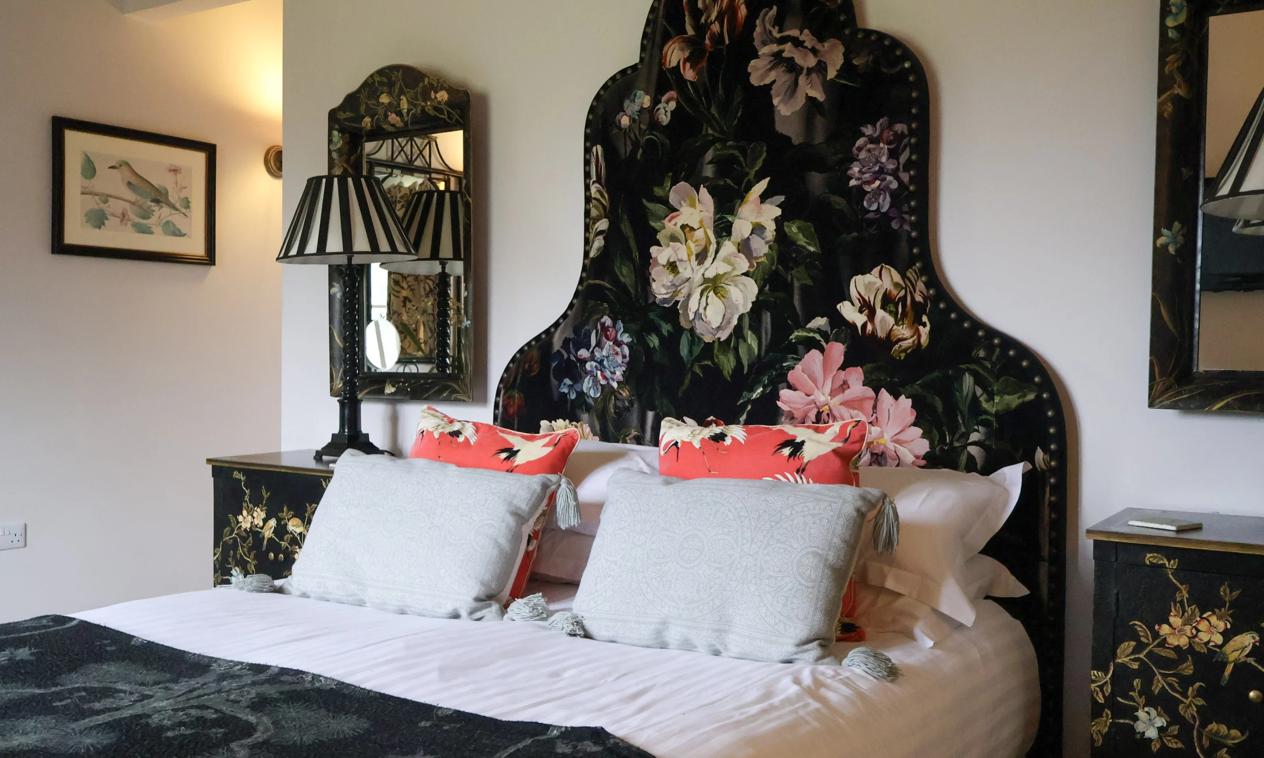 bedroom with ornate headboard at delaval room doddington hall