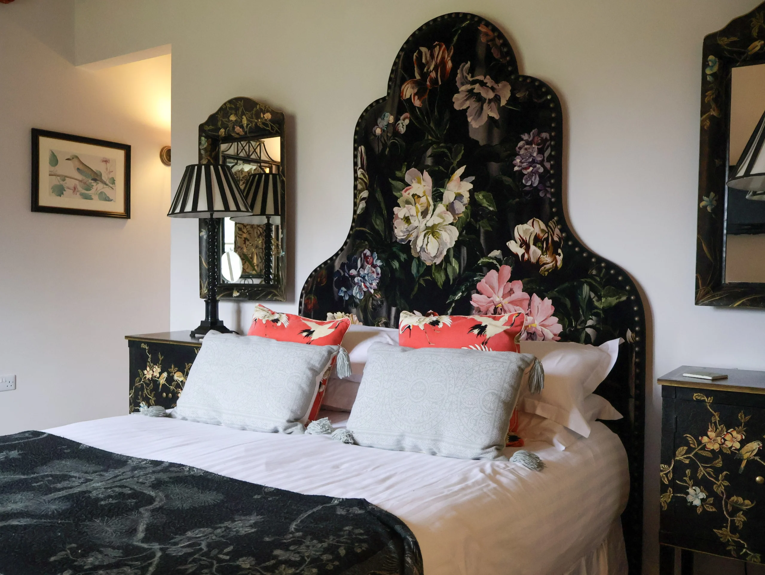 bedroom with ornate headboard at delaval room doddington hall
