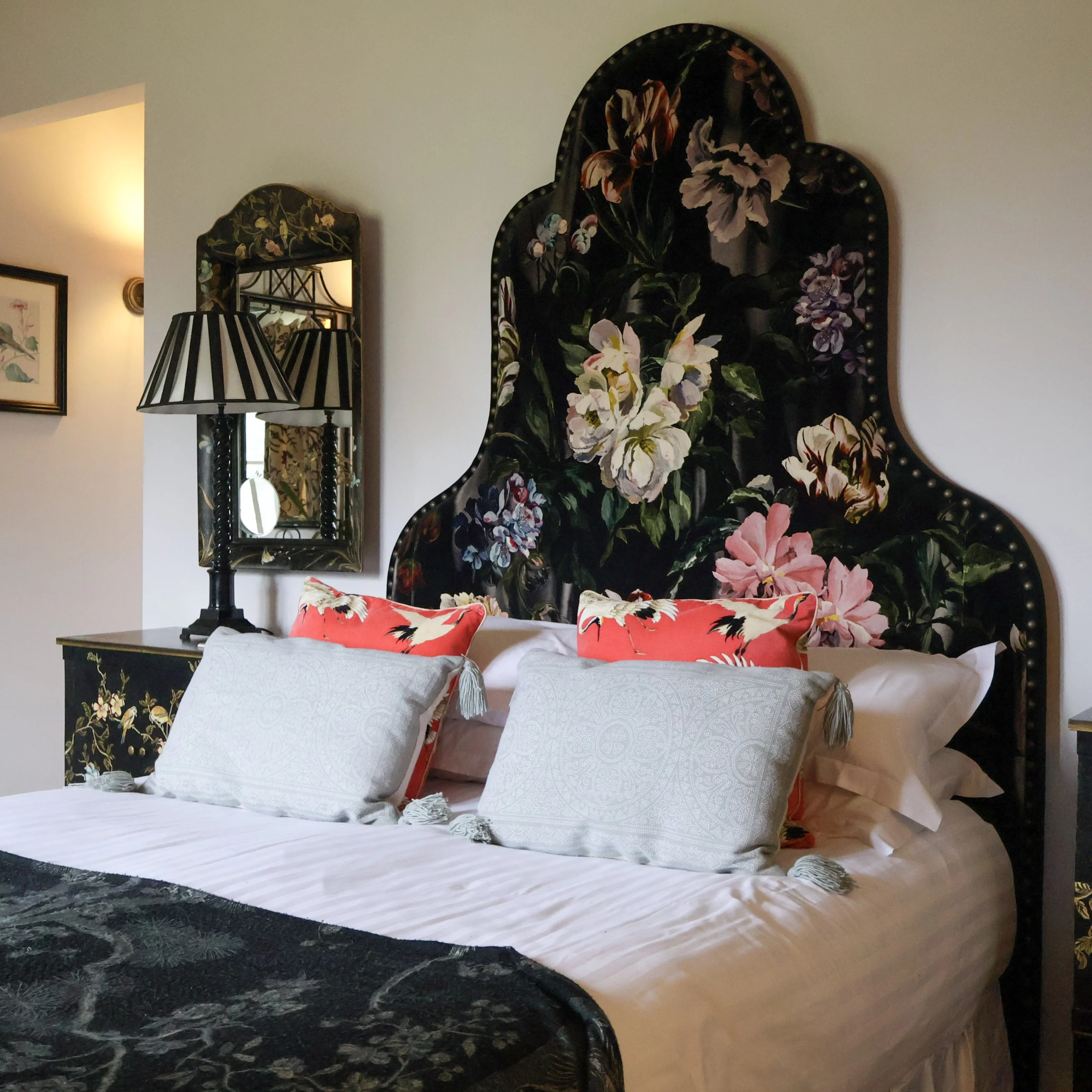 bedroom with ornate headboard at delaval room doddington hall