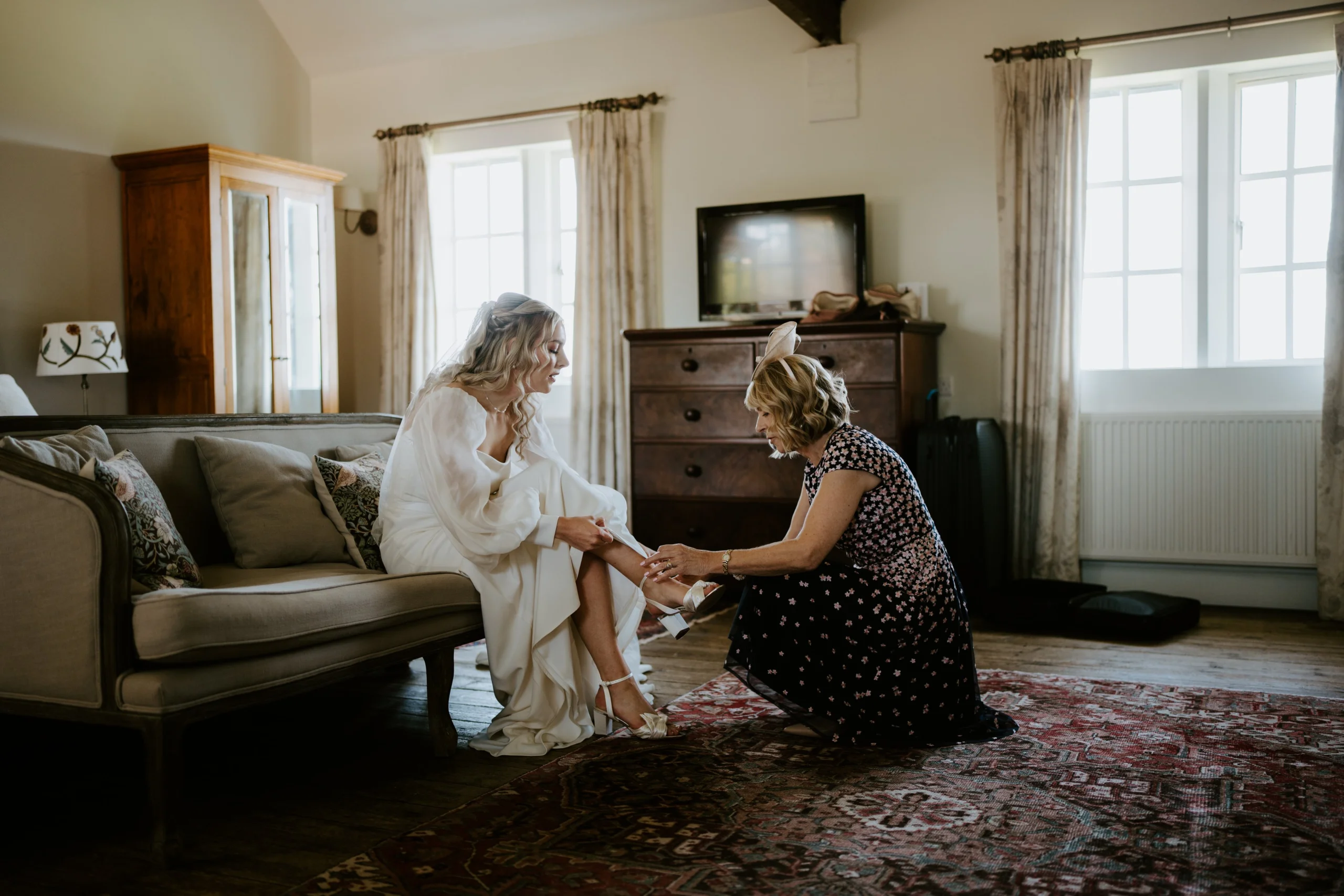 bride with mother inside delaval wedding suite doddington hall