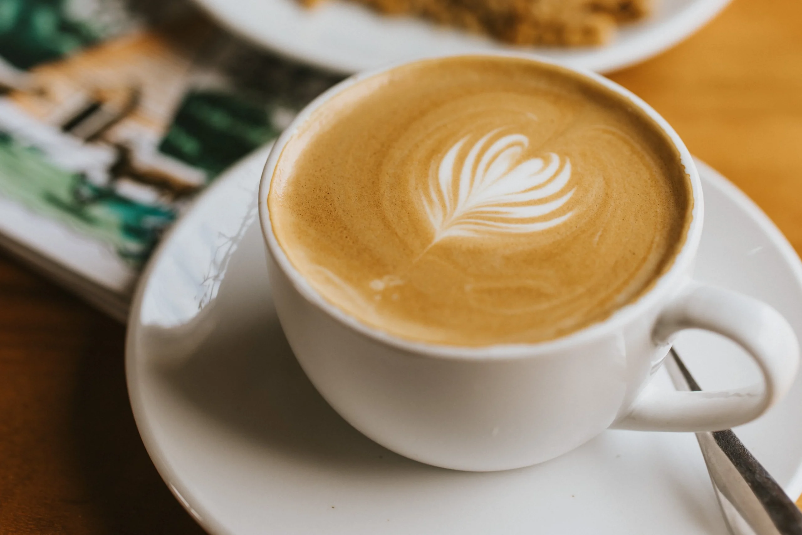 latte in a white cup at doddington farm shop cafe