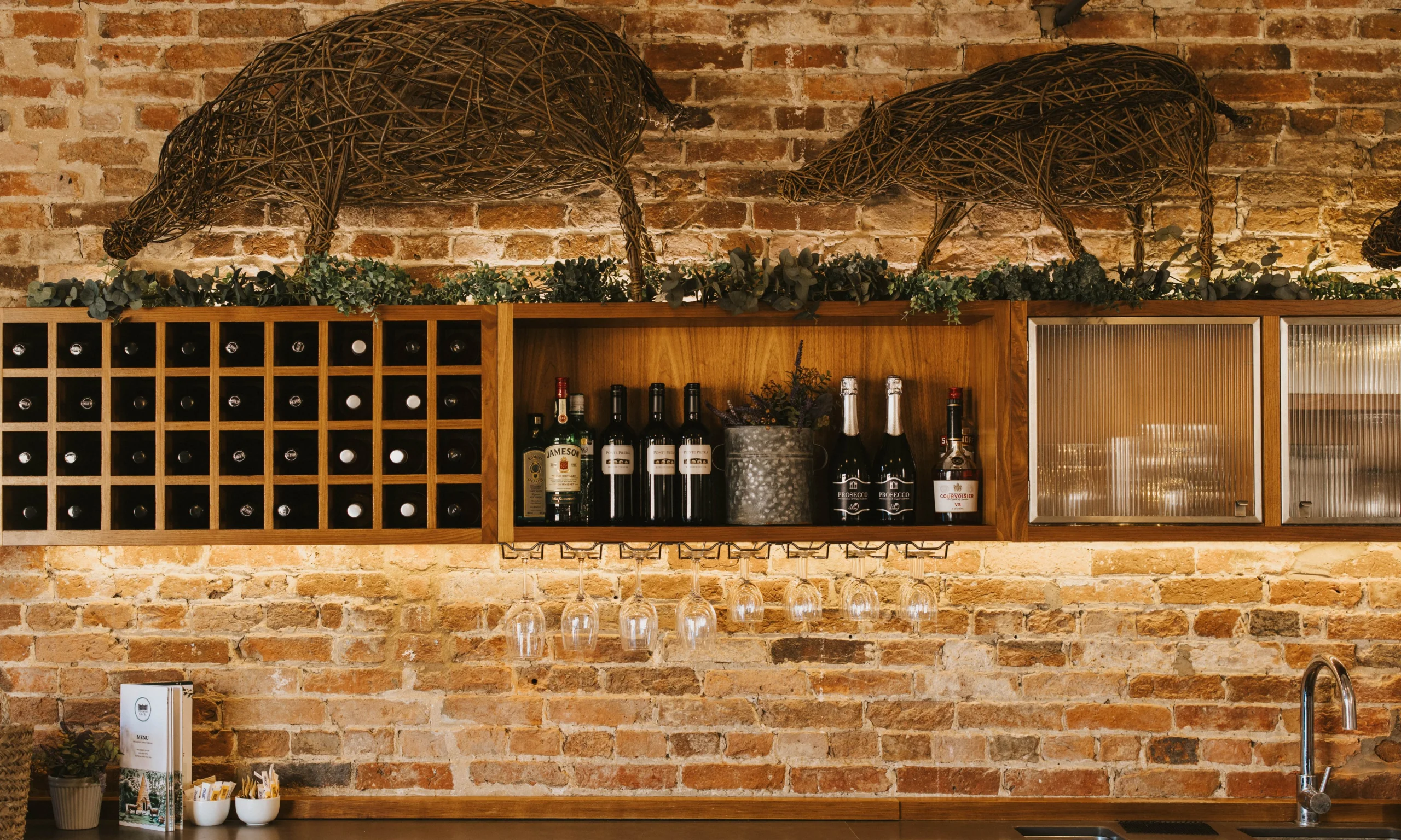 doddington farm shop bar with wooden shelves and wine