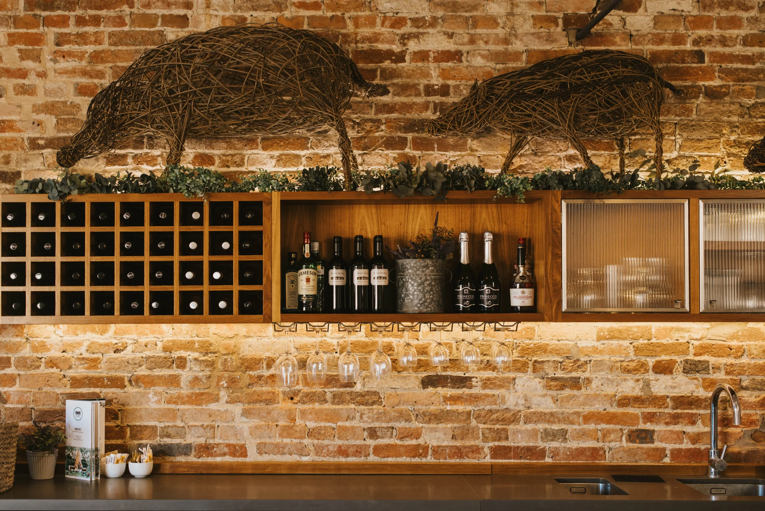 doddington farm shop bar with wooden shelves and wine