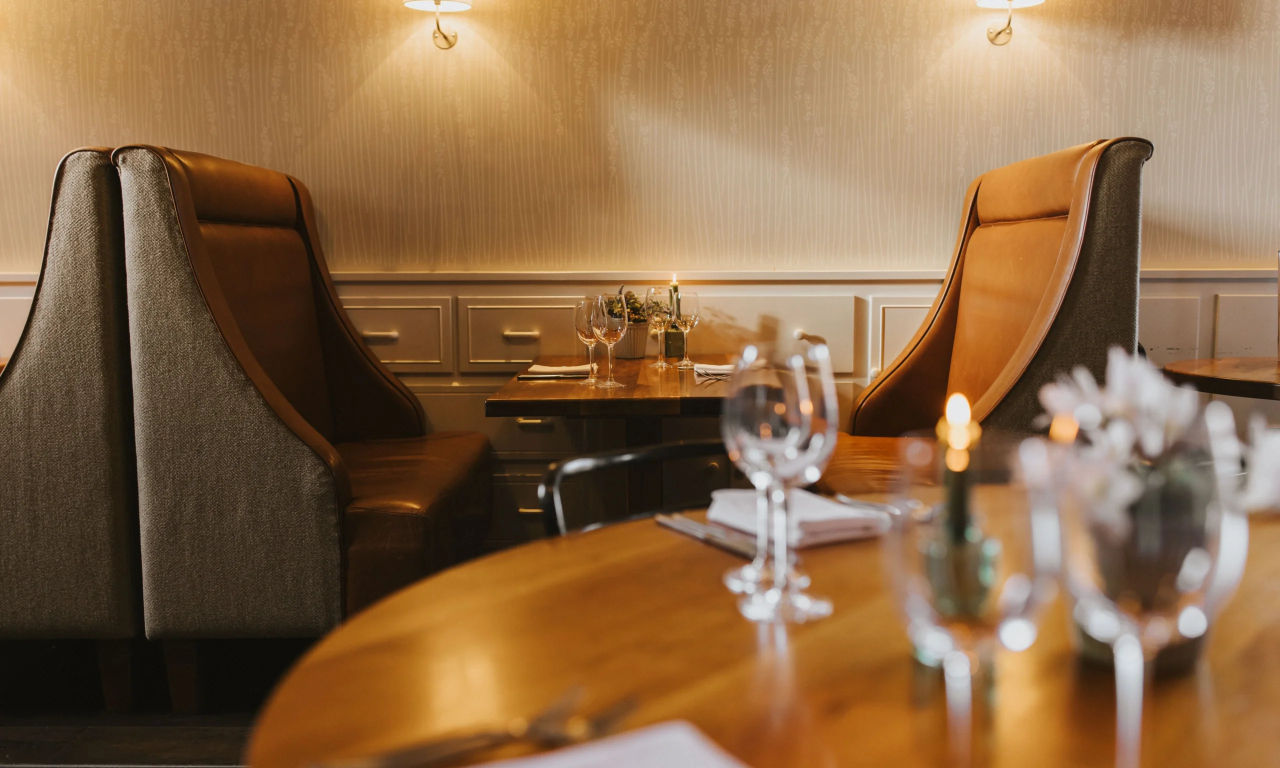 wooden tables with glasses and candles at doddington farm shop cafe