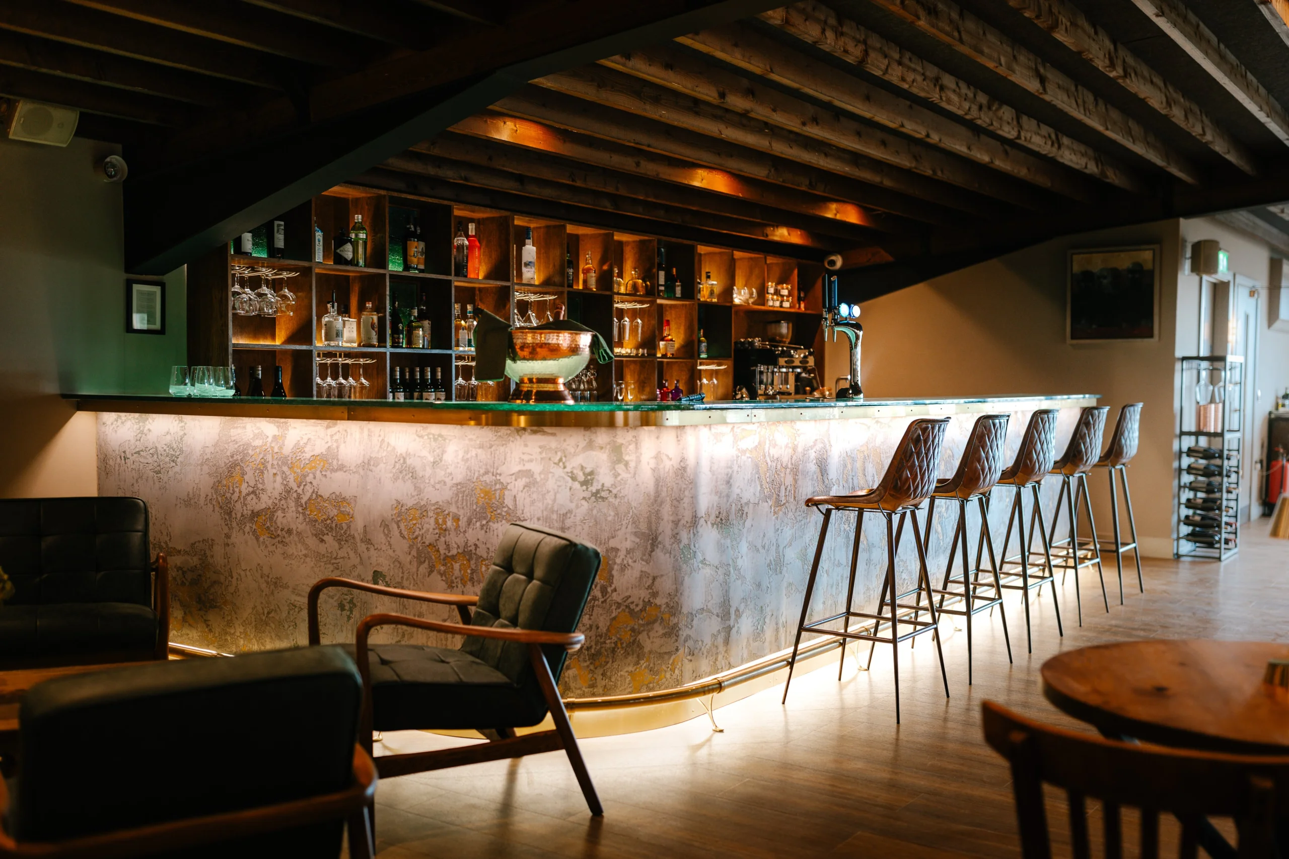 doddington grain store bar with stools and soft seating