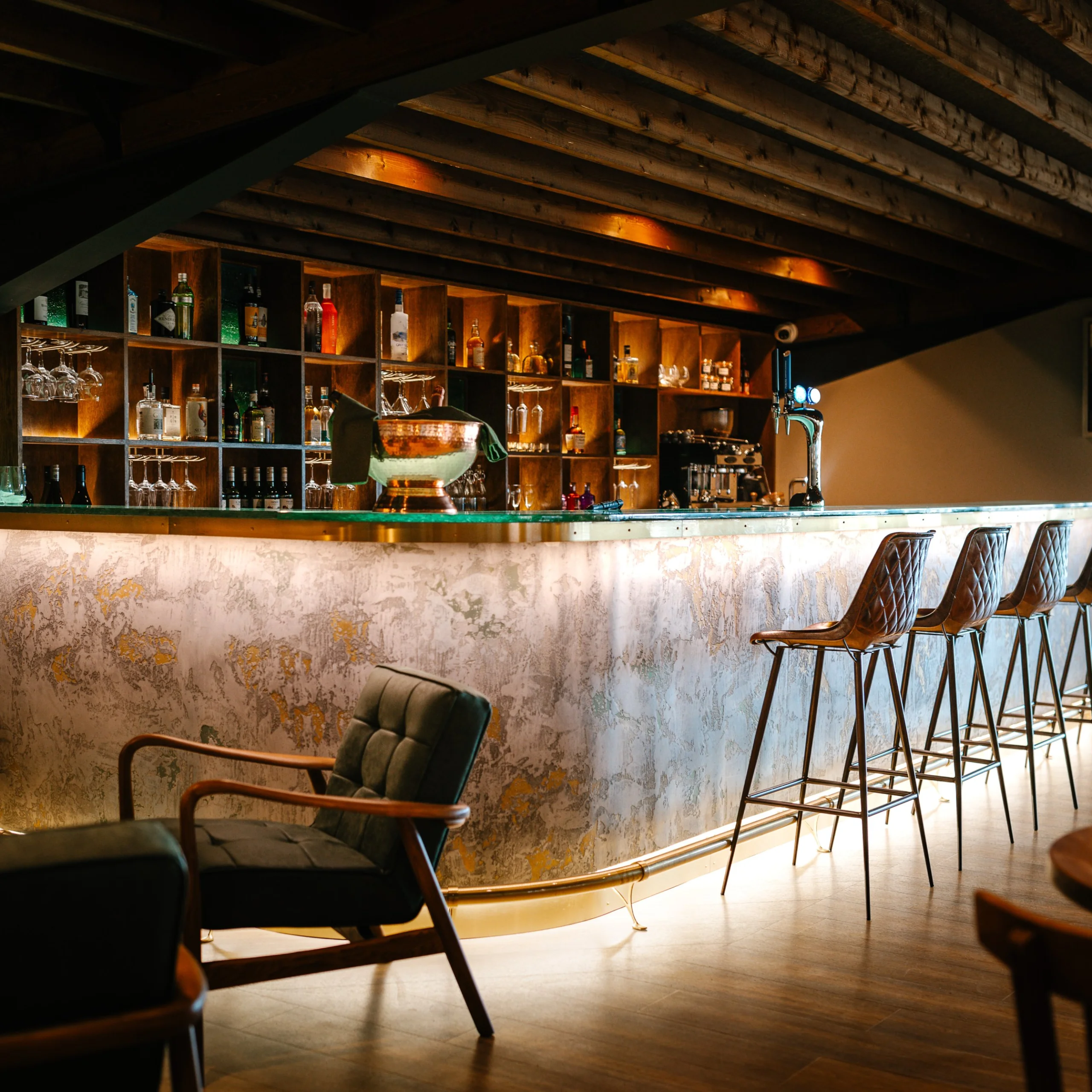 doddington grain store bar with stools and soft seating