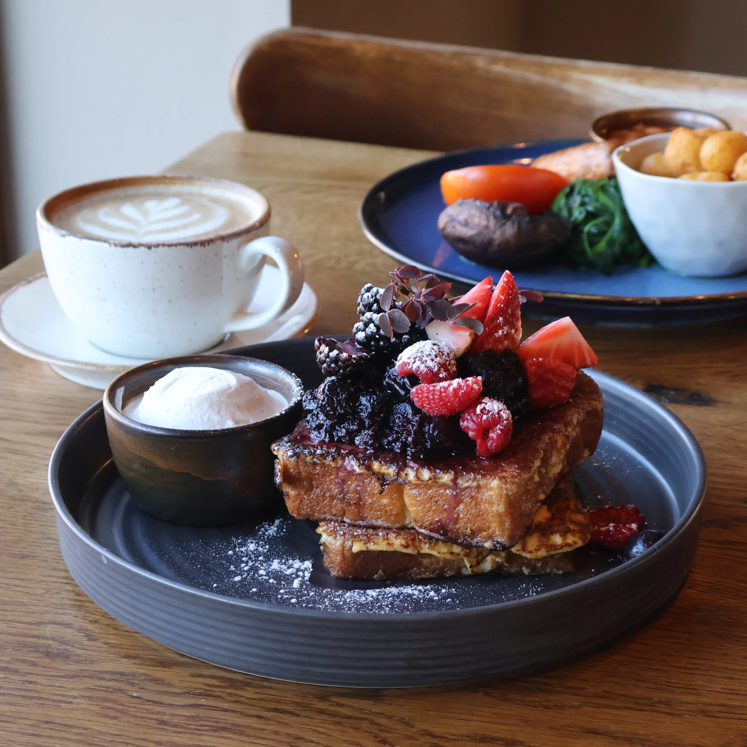 french toast topped with berries at doddington hall farm shop cafe