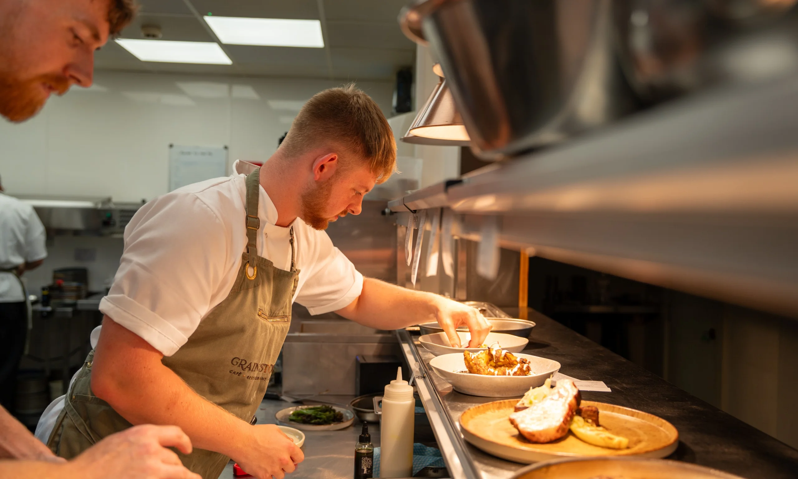 chefs at the pass preparing roast dinner doddington hall