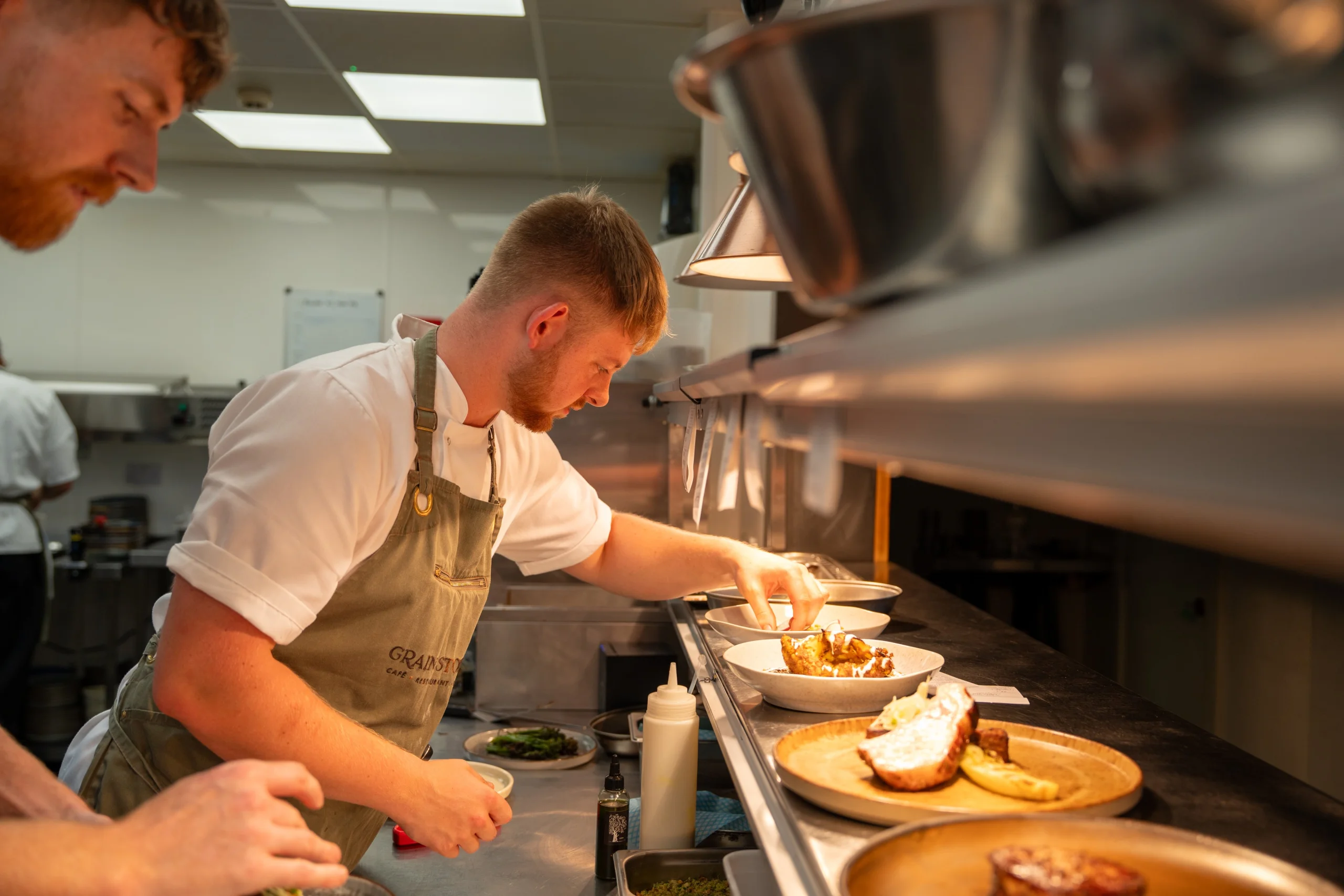 chefs at the pass preparing roast dinner doddington hall
