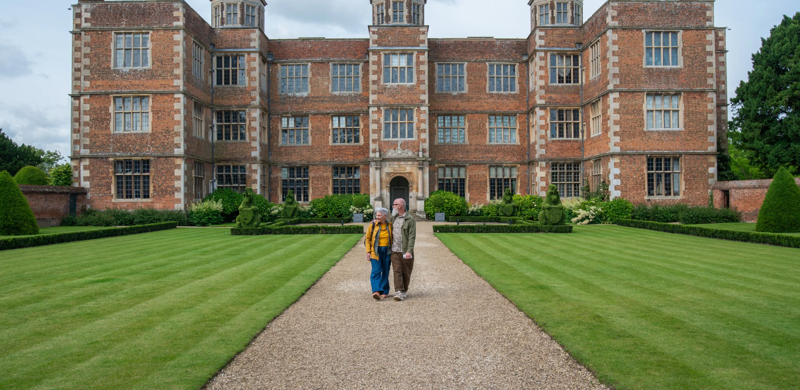 two people in the east front garden at doddington hall