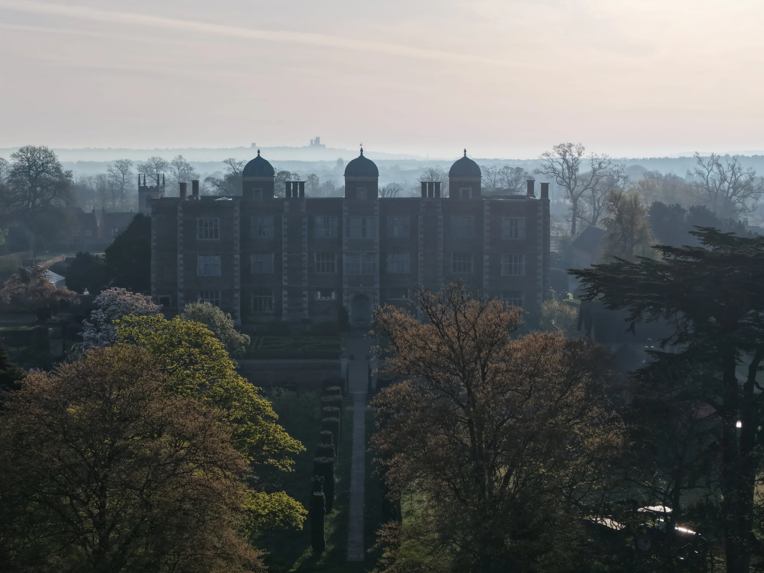 view of doddington hall with lincoln cathedral in the distance