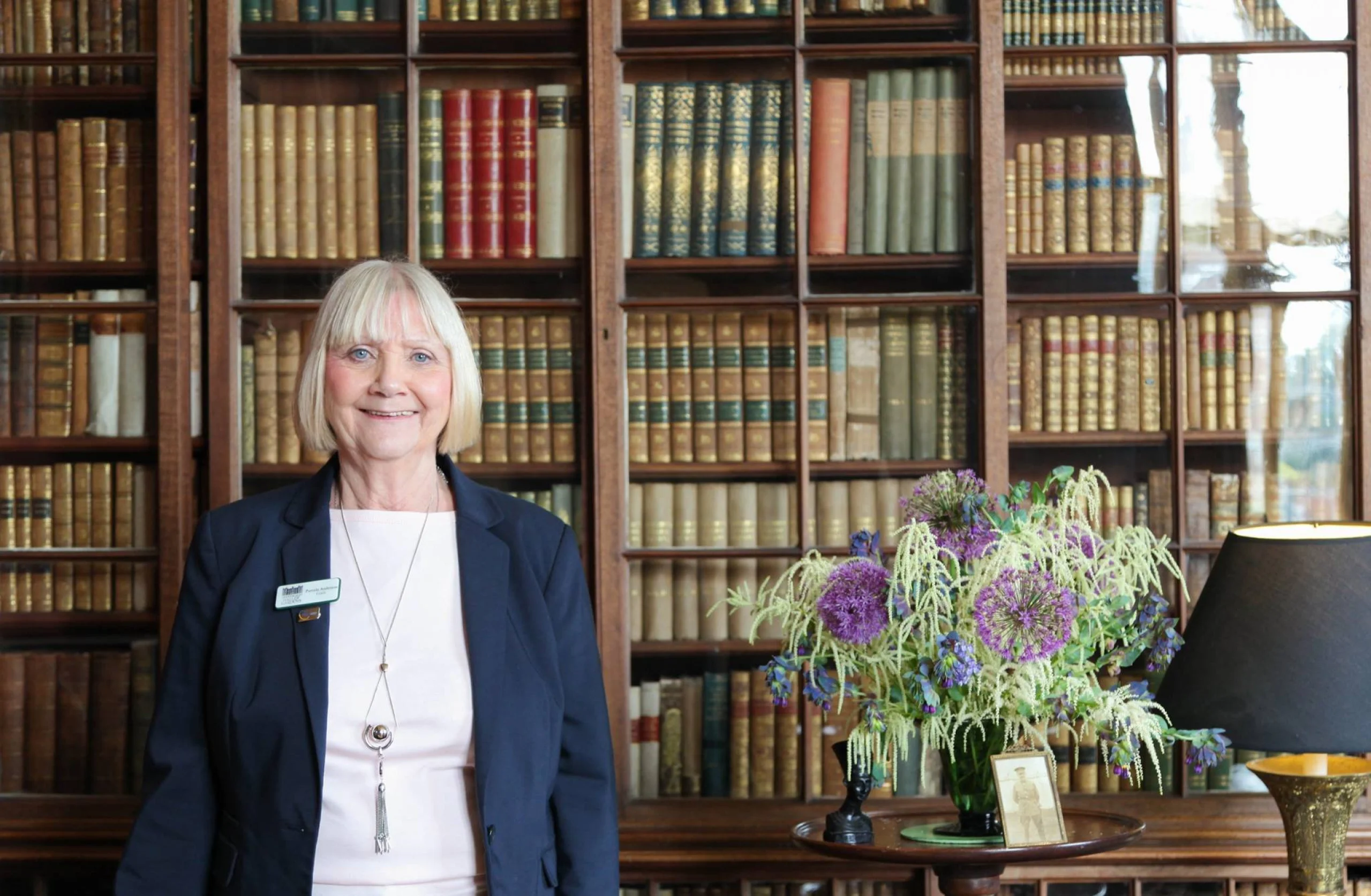 lady stood next to a floral display doddington hall