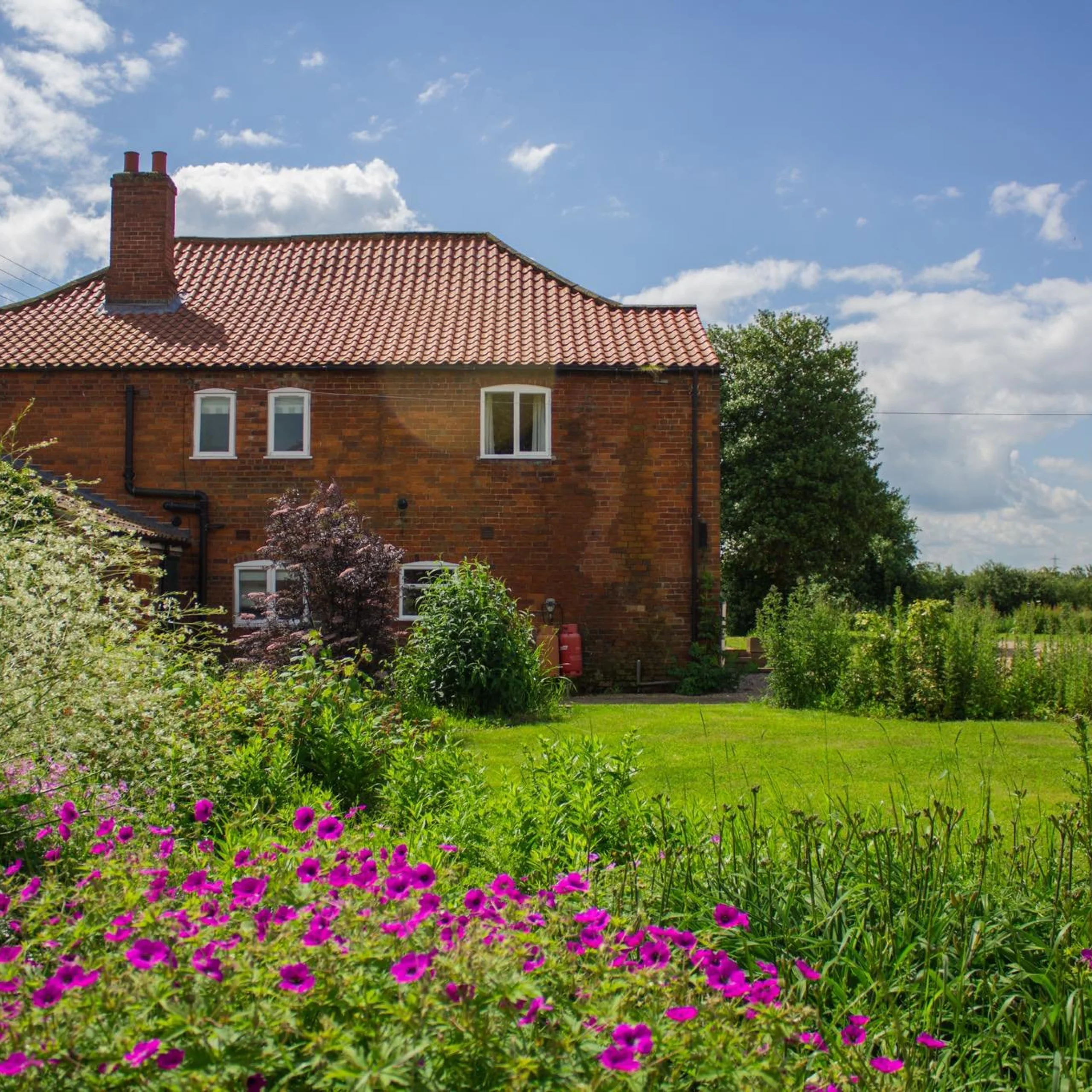 a quaint red brick cottage exterior holly farm doddington hall