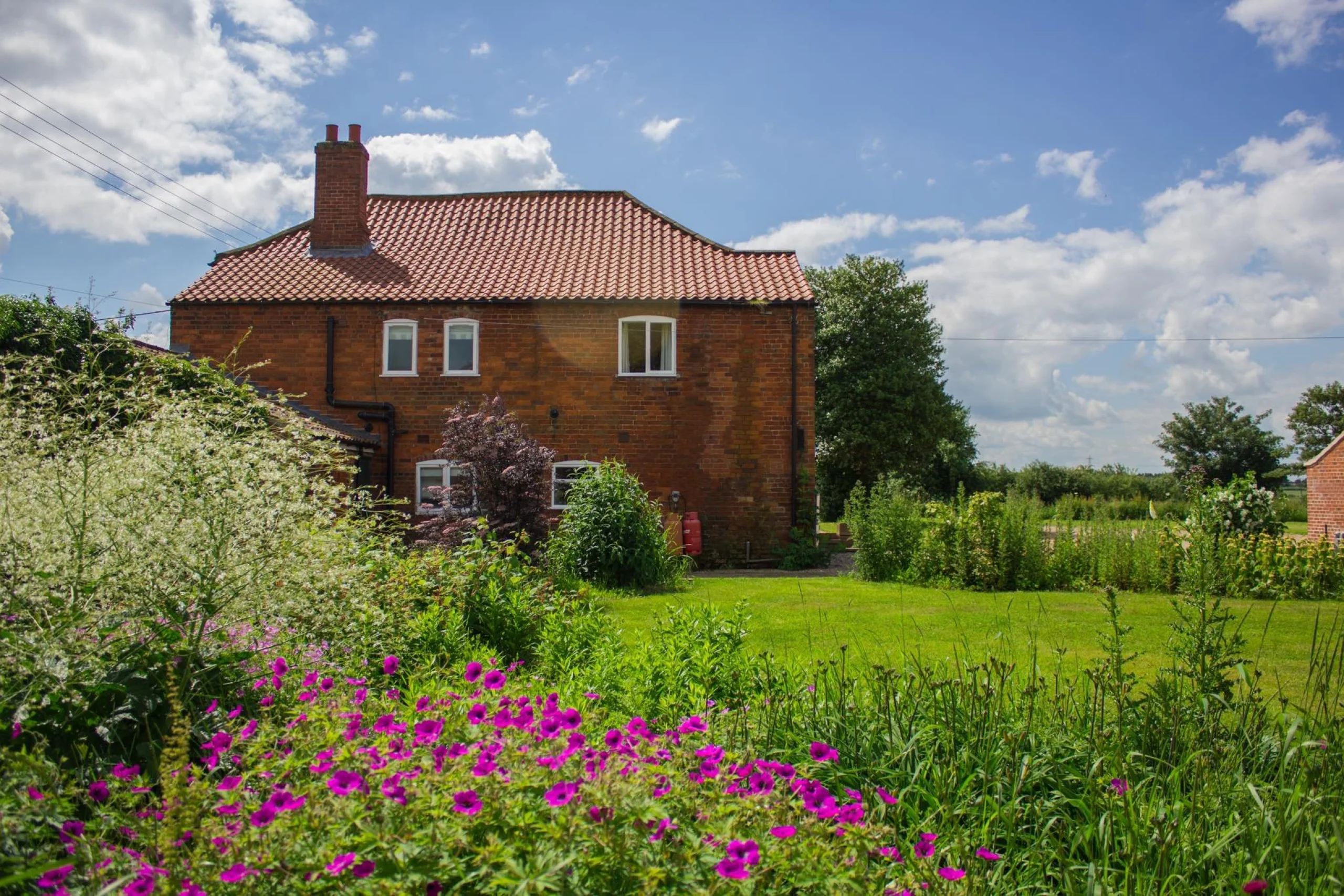 a quaint red brick cottage exterior holly farm doddington hall