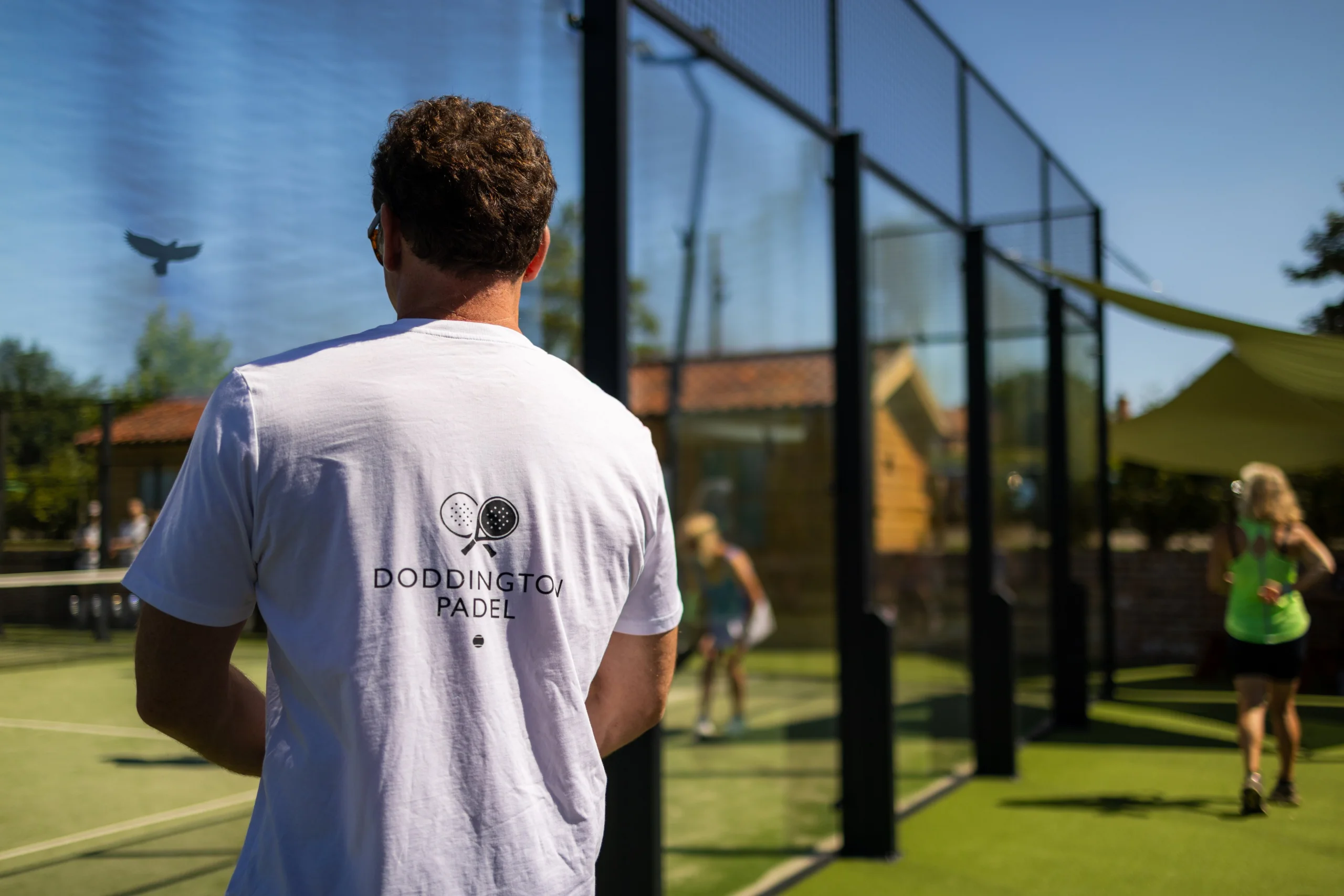 doddington padel white tshirt on a man