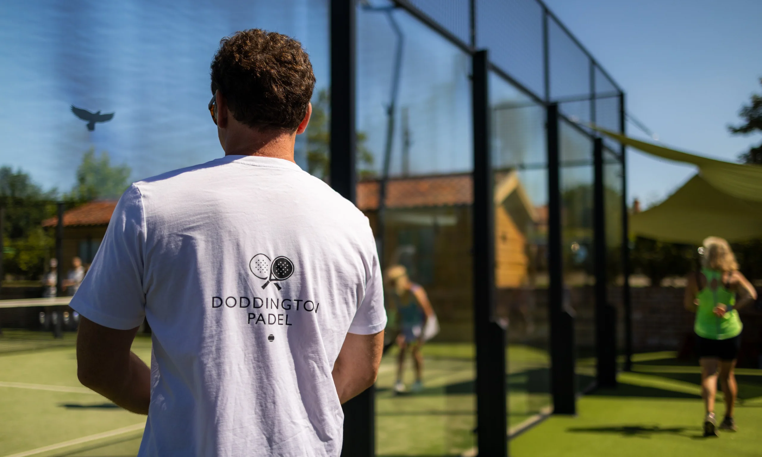 doddington padel white tshirt on a man