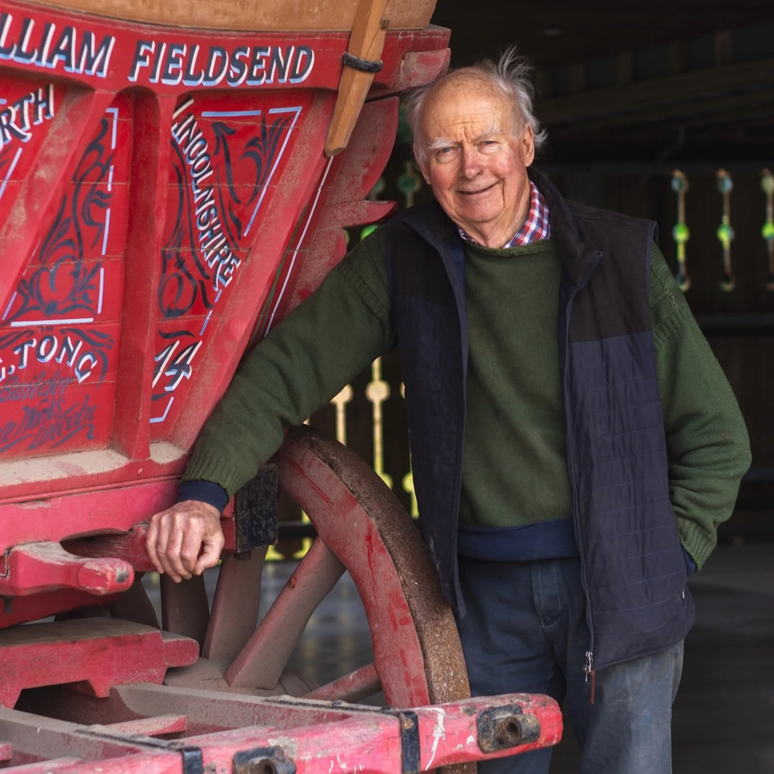 photo of anthony jarvis next to a red wagon at doddington hall