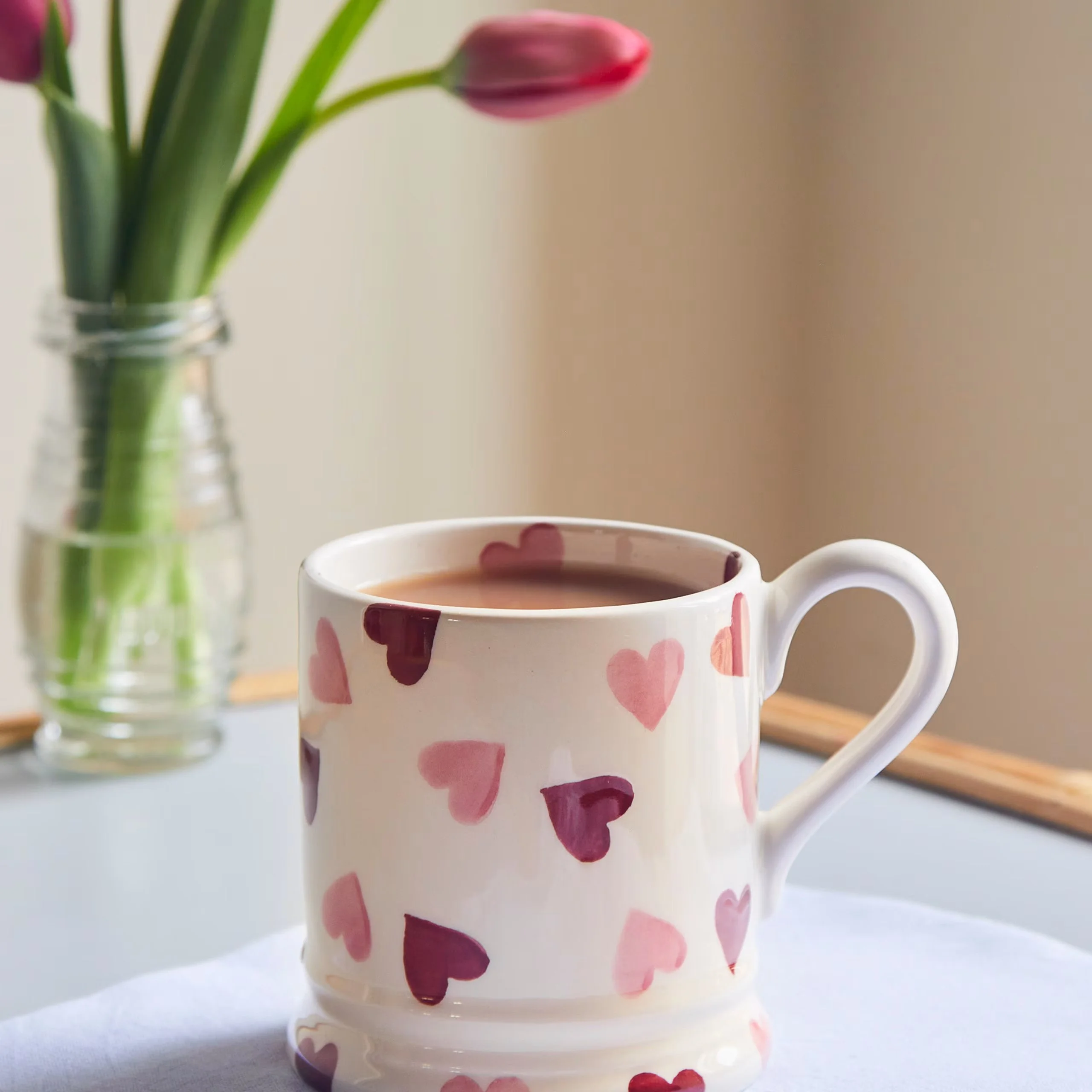 a mug with red and pink hearts by emma bridgewater