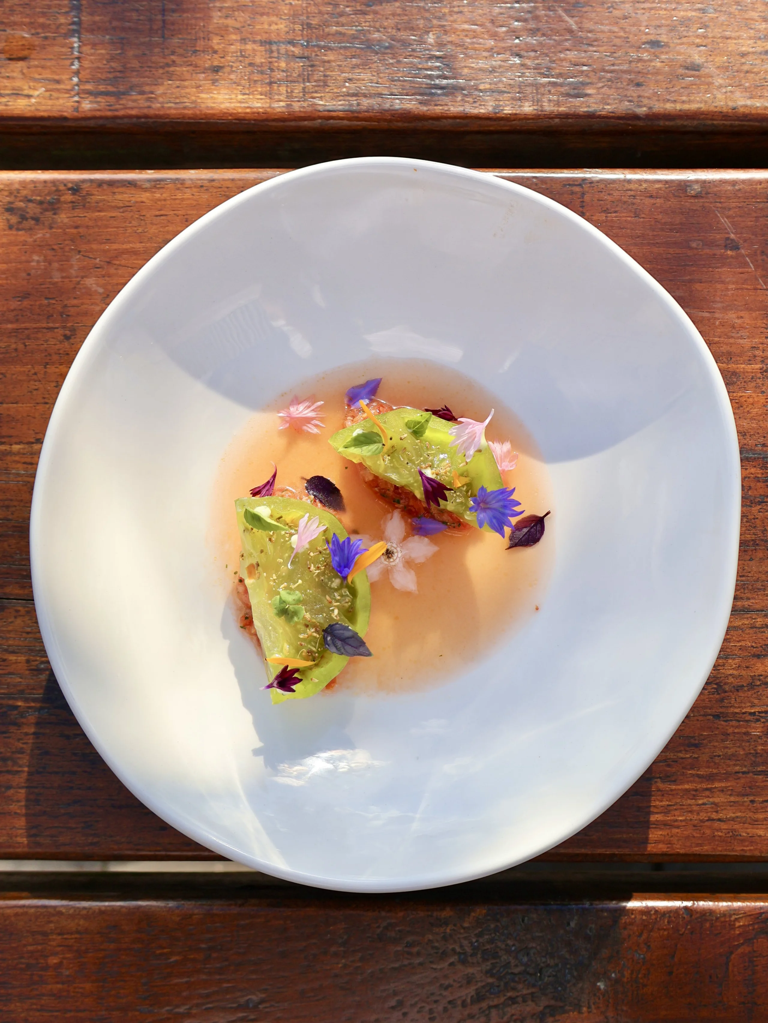 a tomato starter decorated with edible flowers at doddington hall