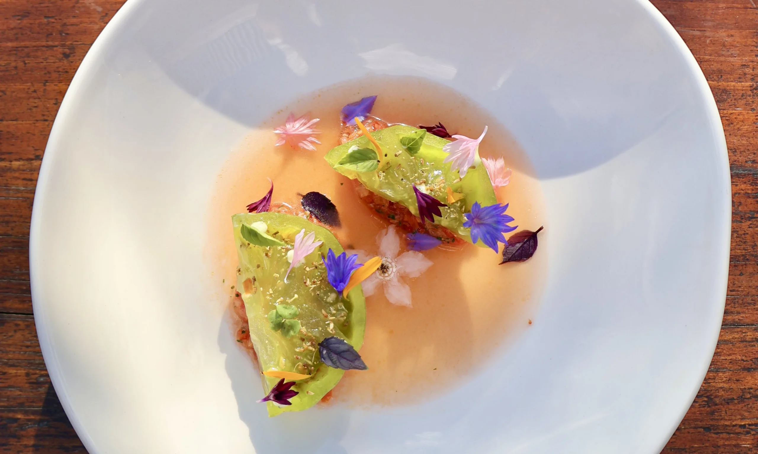 a tomato starter decorated with edible flowers at doddington hall