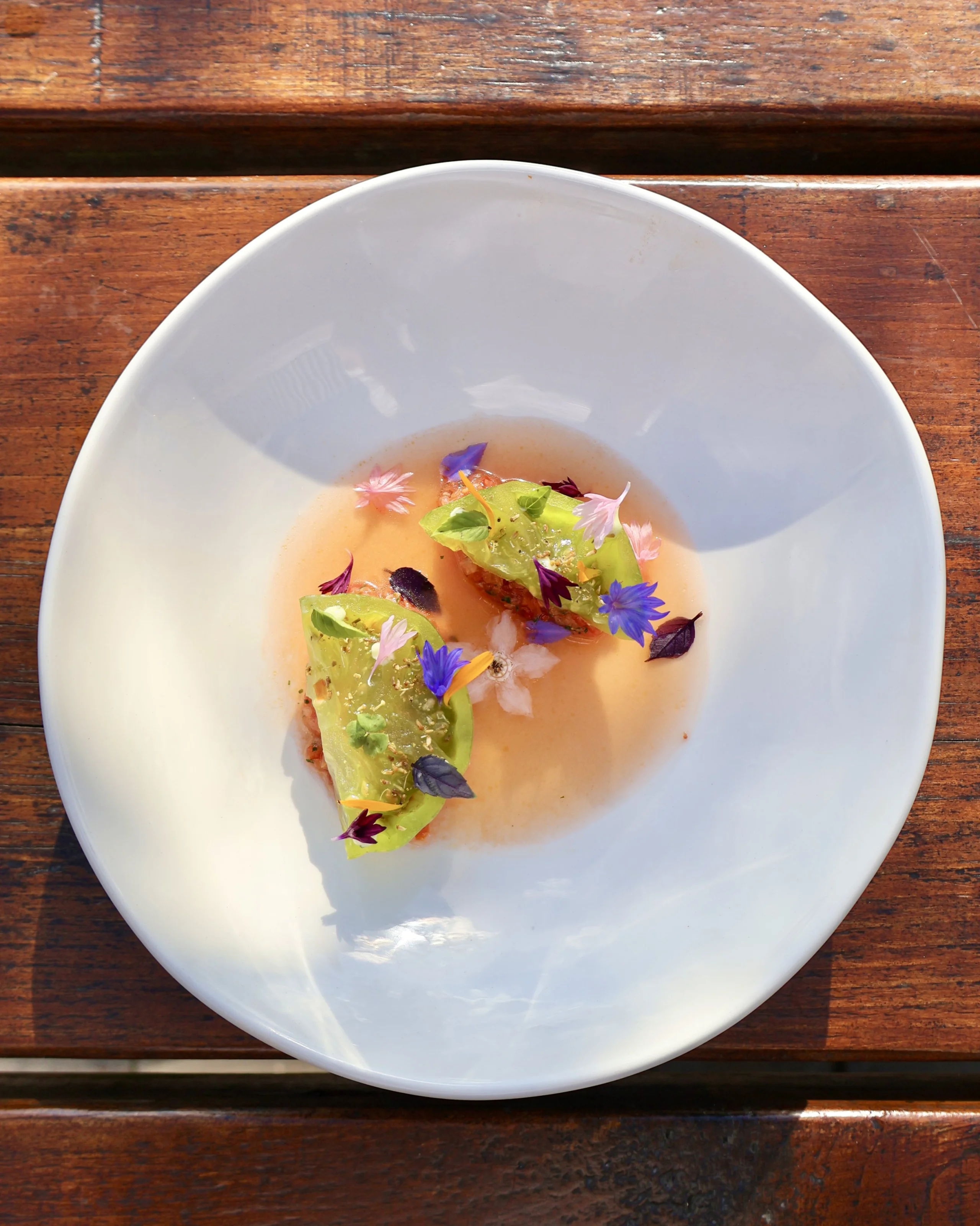 a tomato starter decorated with edible flowers at doddington hall