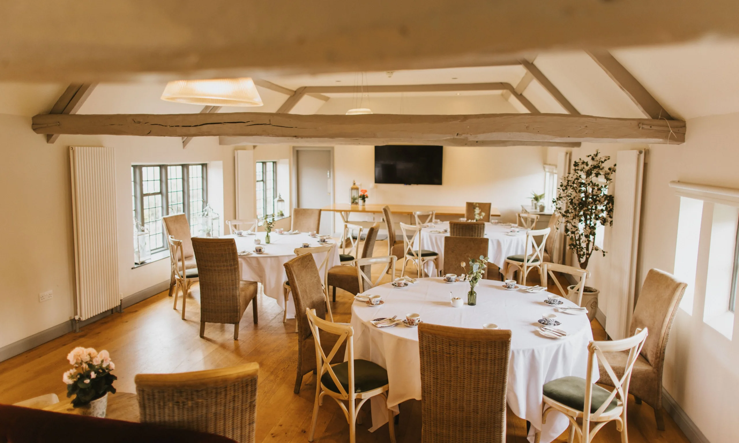 tables and chairs in the jarvis room at doddington coach house