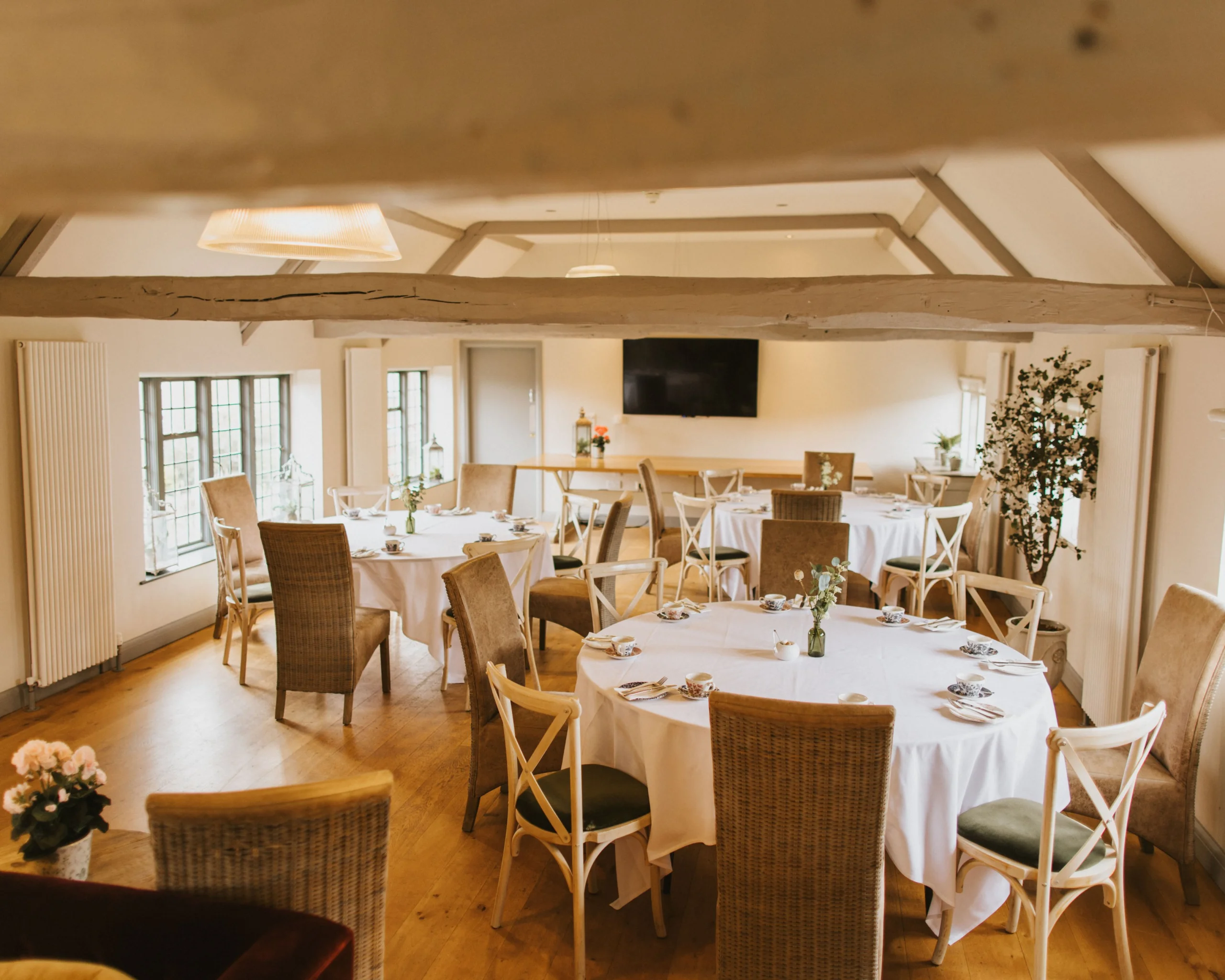 tables and chairs in the jarvis room at doddington coach house