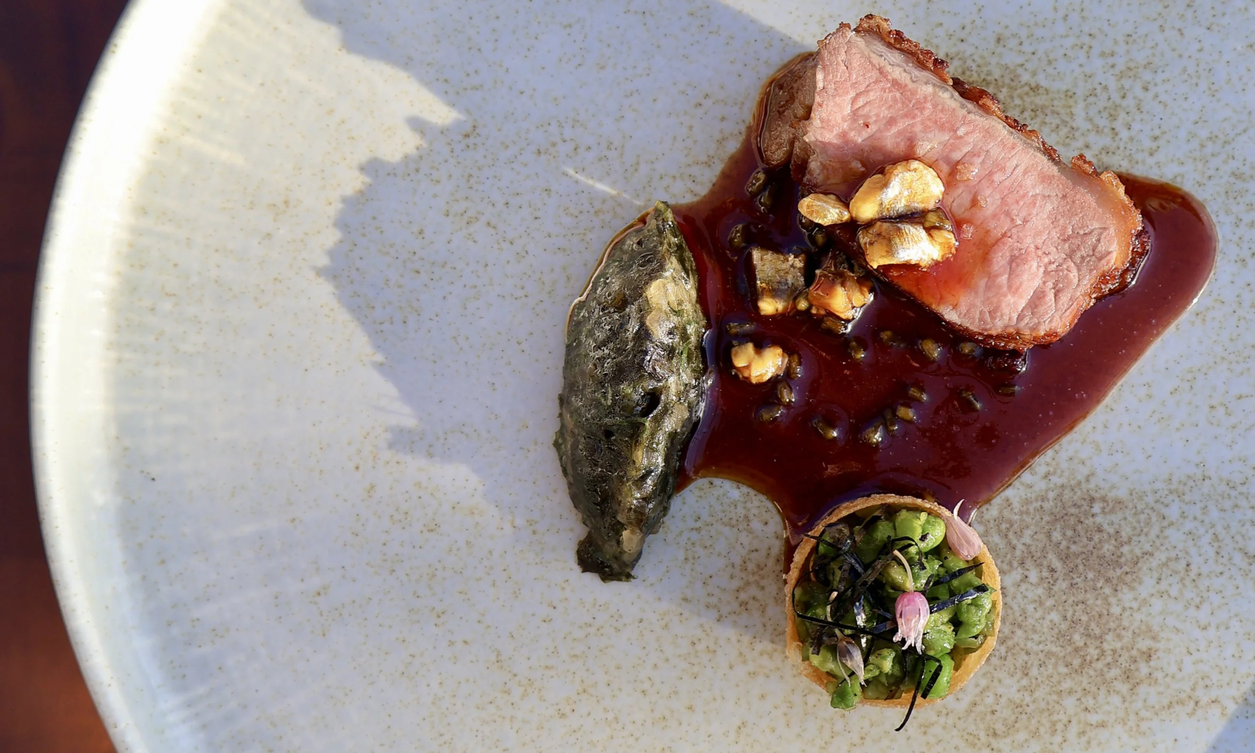 close up of lamb dish at a supper club at doddington hall grain store