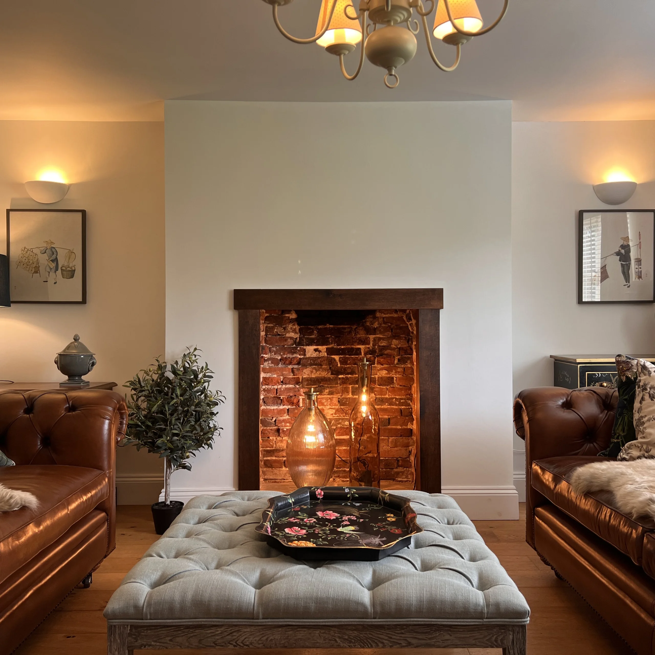 a living room with sofas and a fireplace at grange farm doddington hall