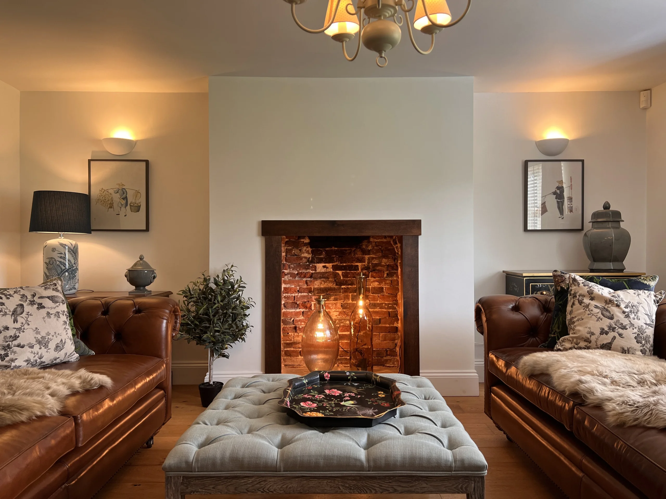 a living room with sofas and a fireplace at grange farm doddington hall