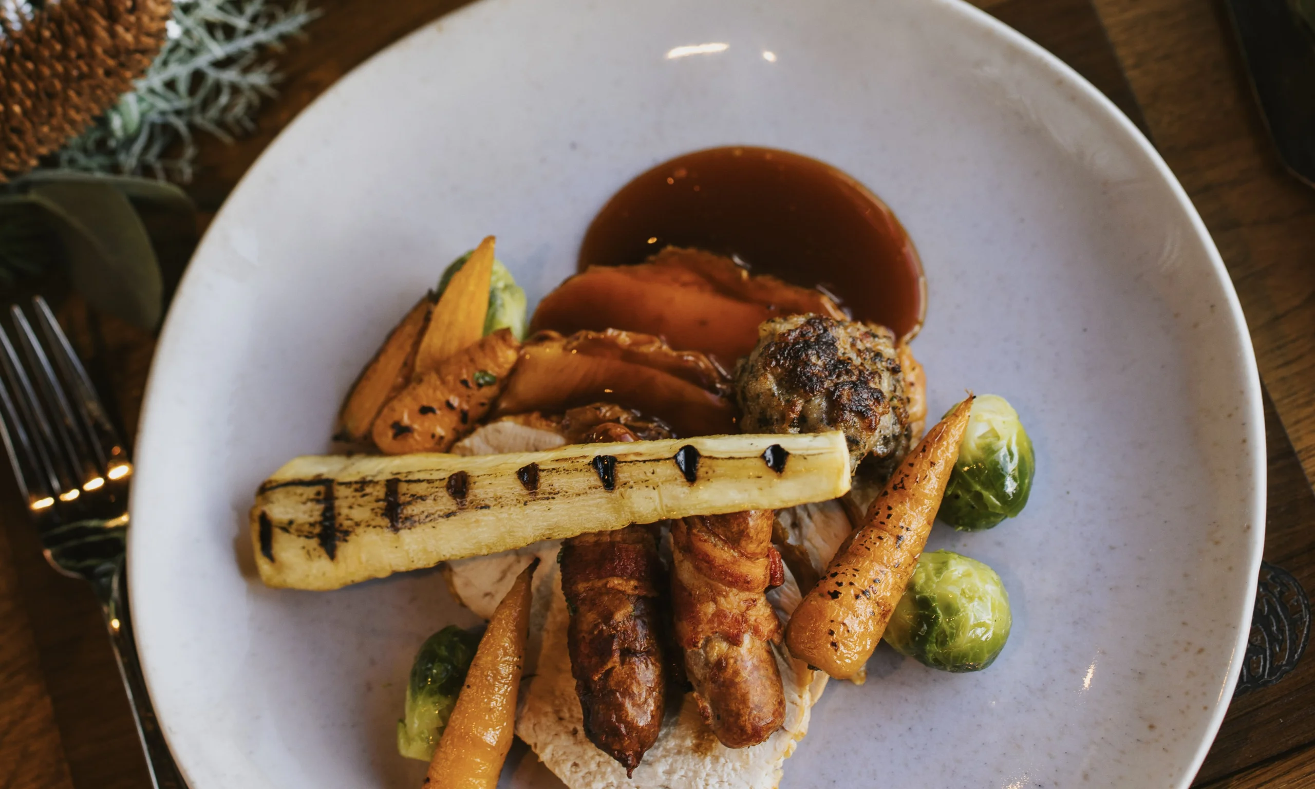 roasted parsnips on a plate with turkey at doddington hall grain store