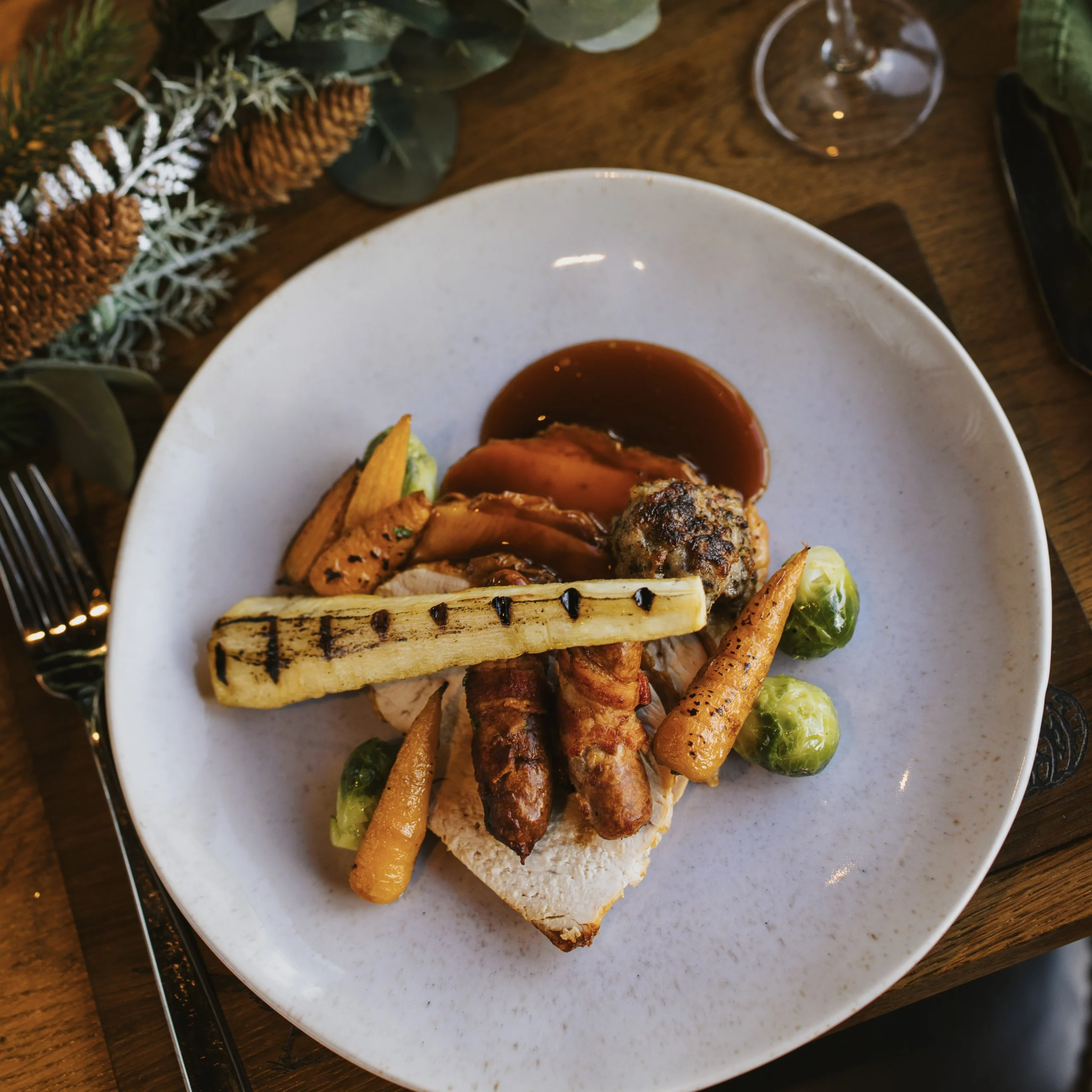 roasted parsnips on a plate with turkey at doddington hall grain store