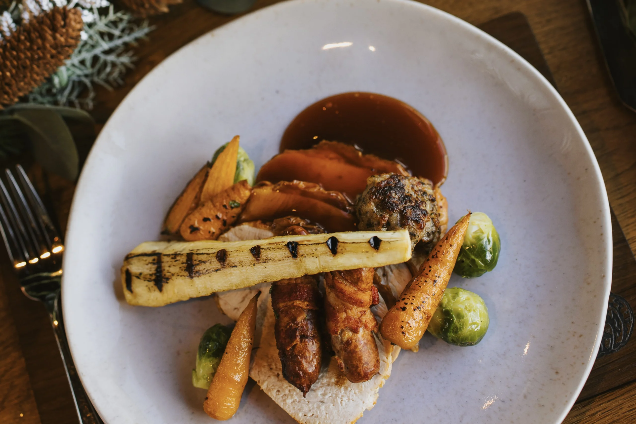 roasted parsnips on a plate with turkey at doddington hall grain store