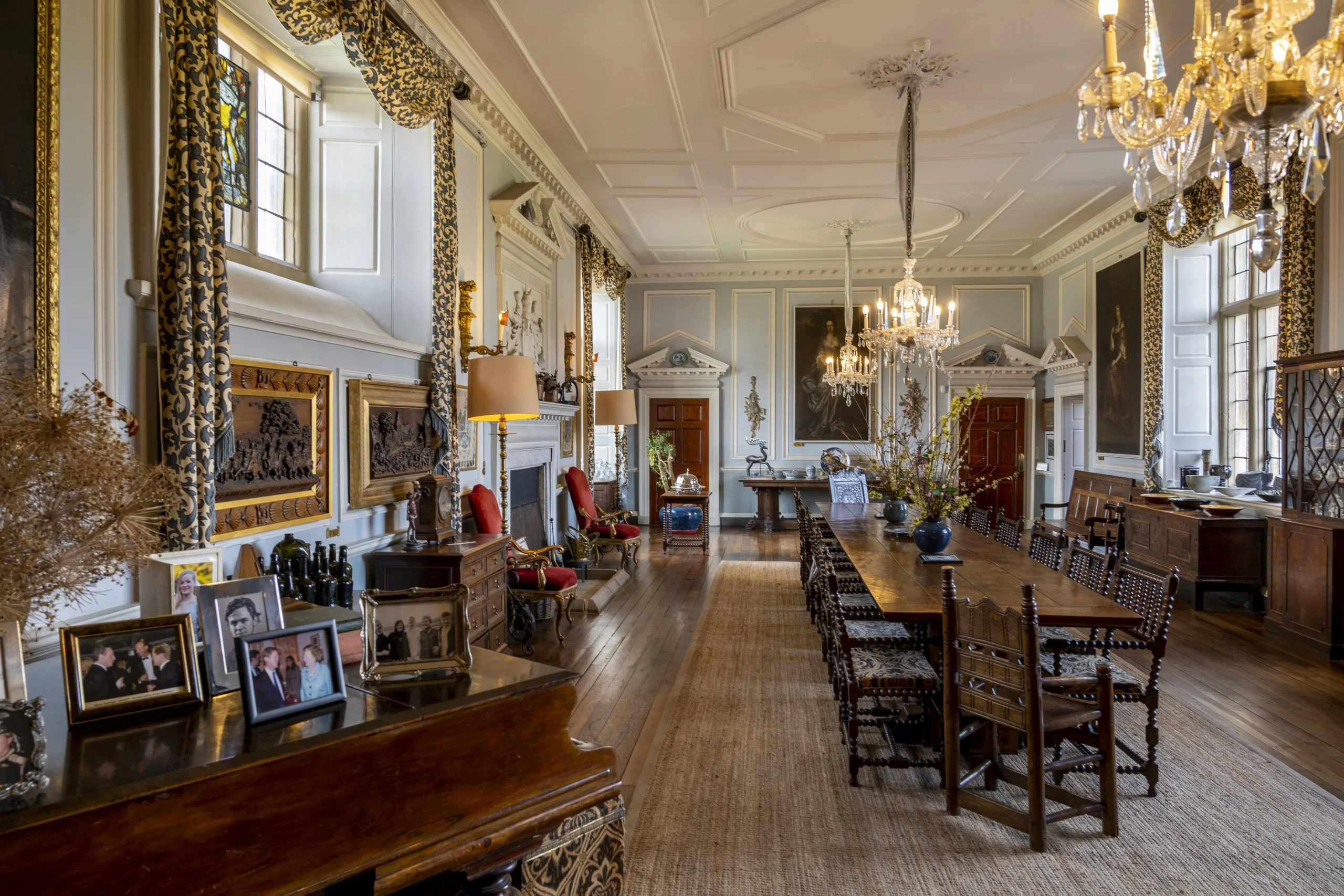 A dining room filled with antiques and ornate furniture