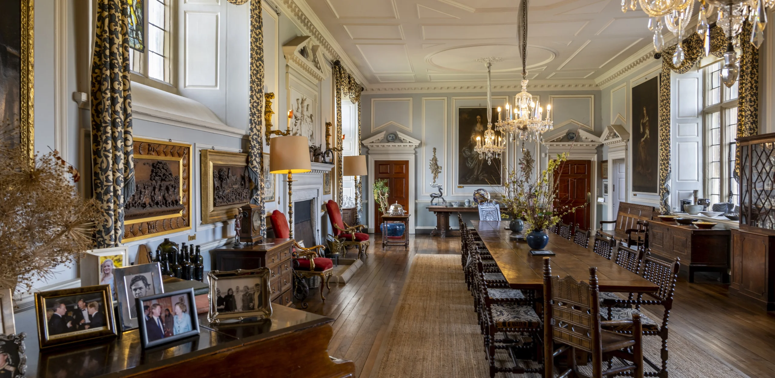 A dining room filled with antiques and ornate furniture