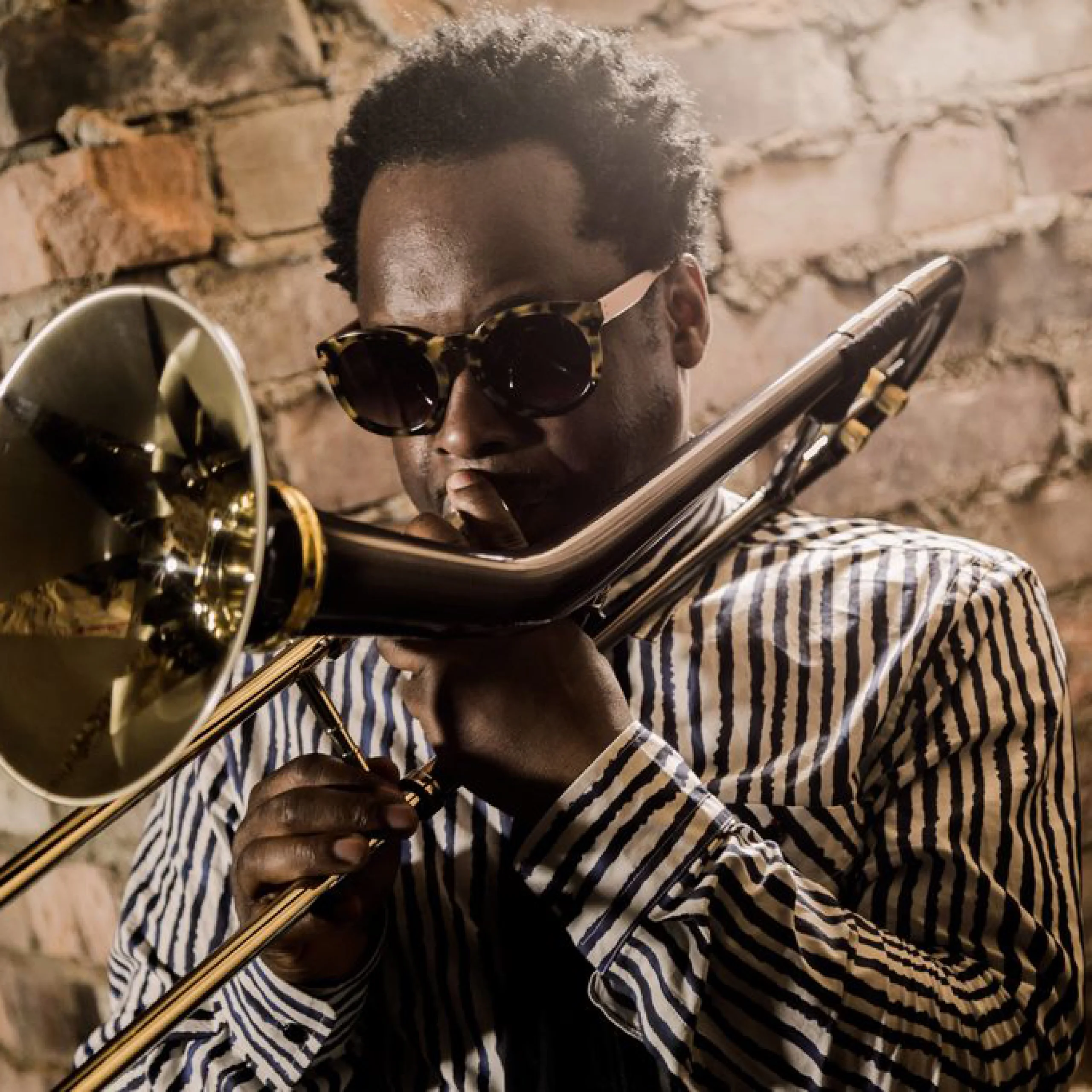 close up photo of dennis rollins playing the trombone at doddington jazz night