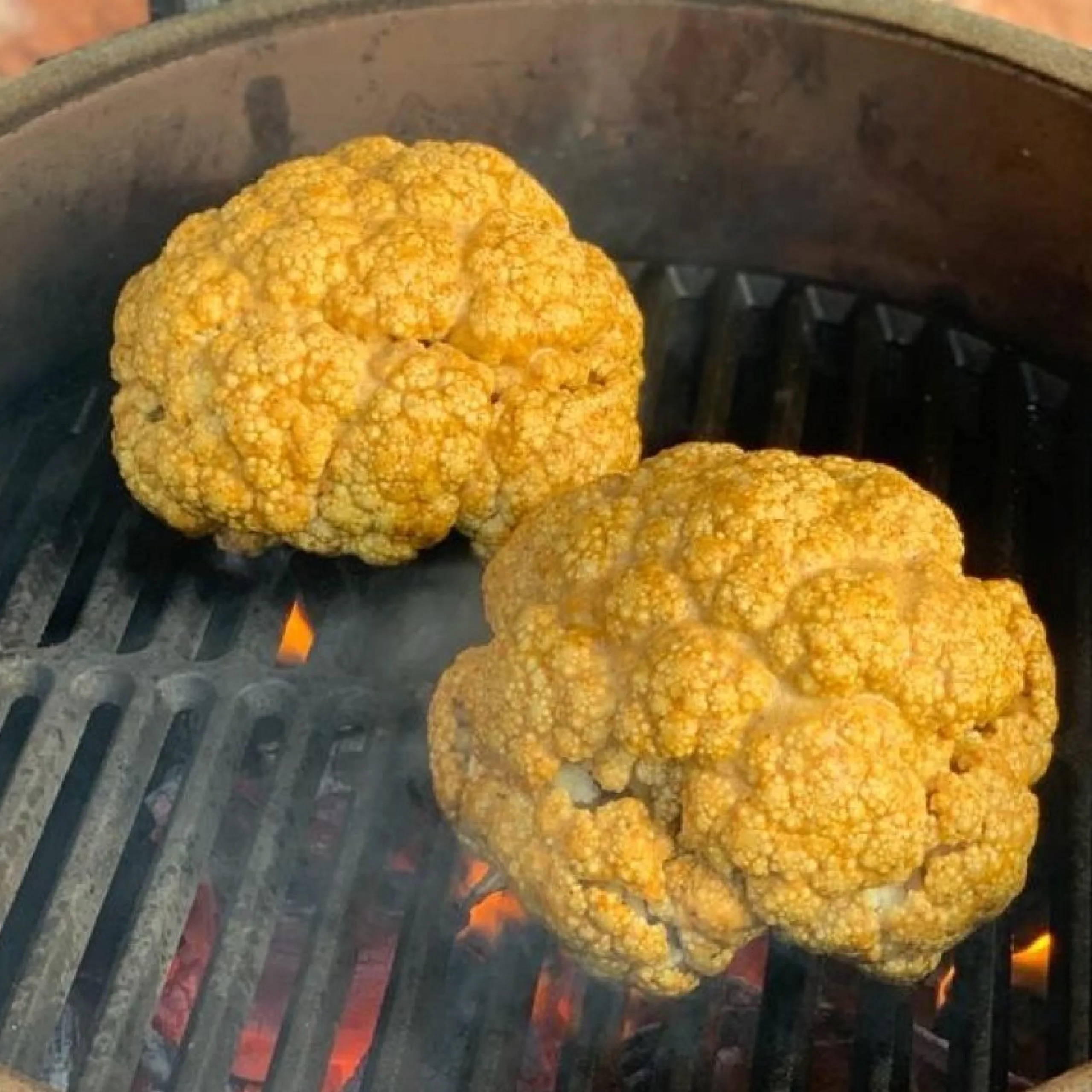 cauliflower heads on a bbq grill