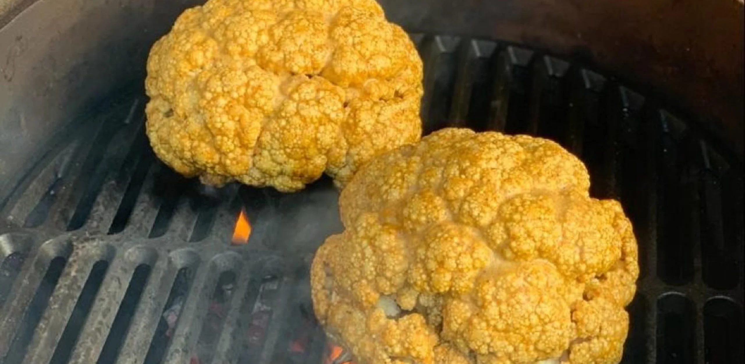 cauliflower heads on a bbq grill