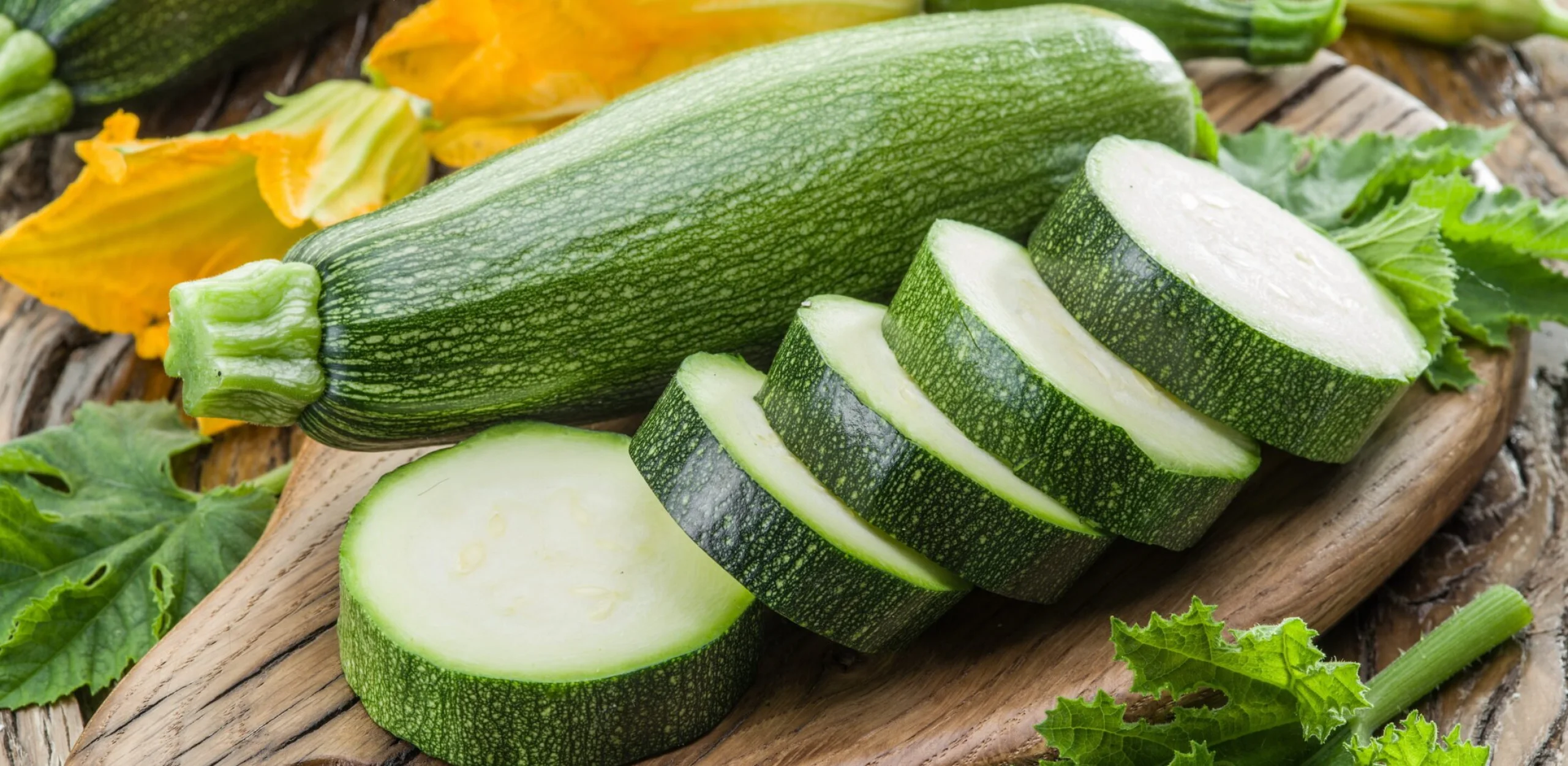 sliced courgettes on a wooden board