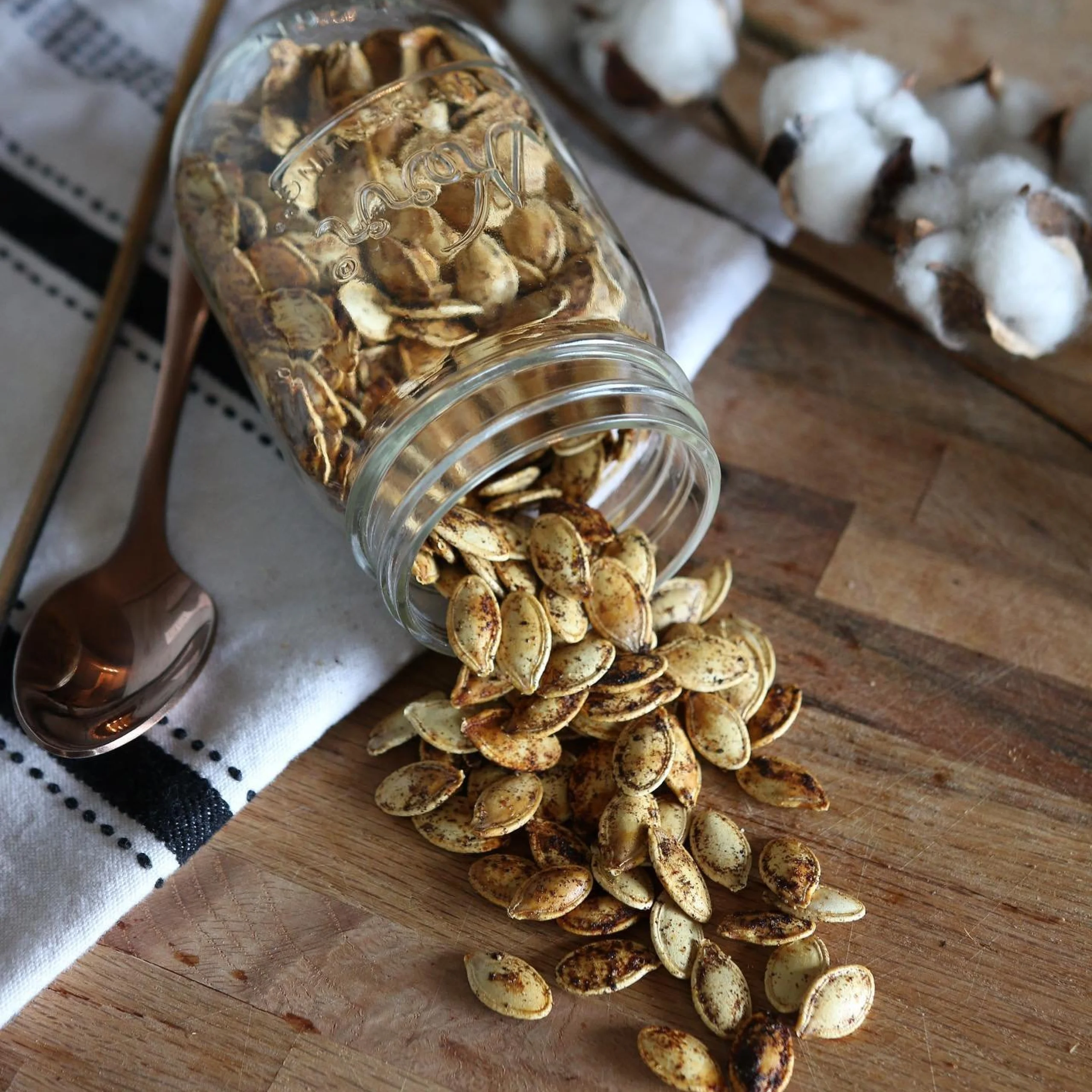 roasted pumpkin seeds with spices in a glass jar