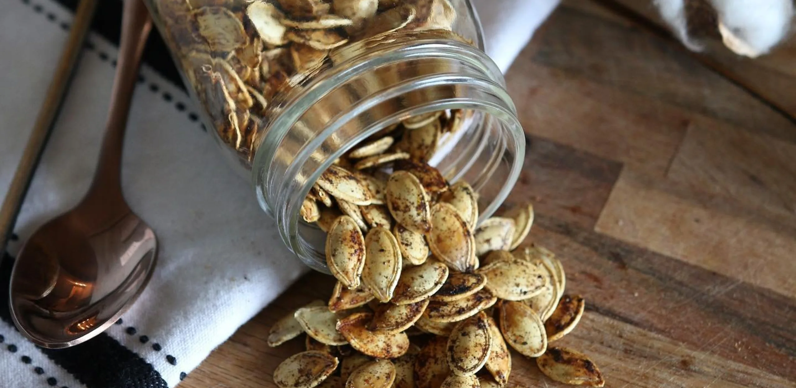roasted pumpkin seeds with spices in a glass jar