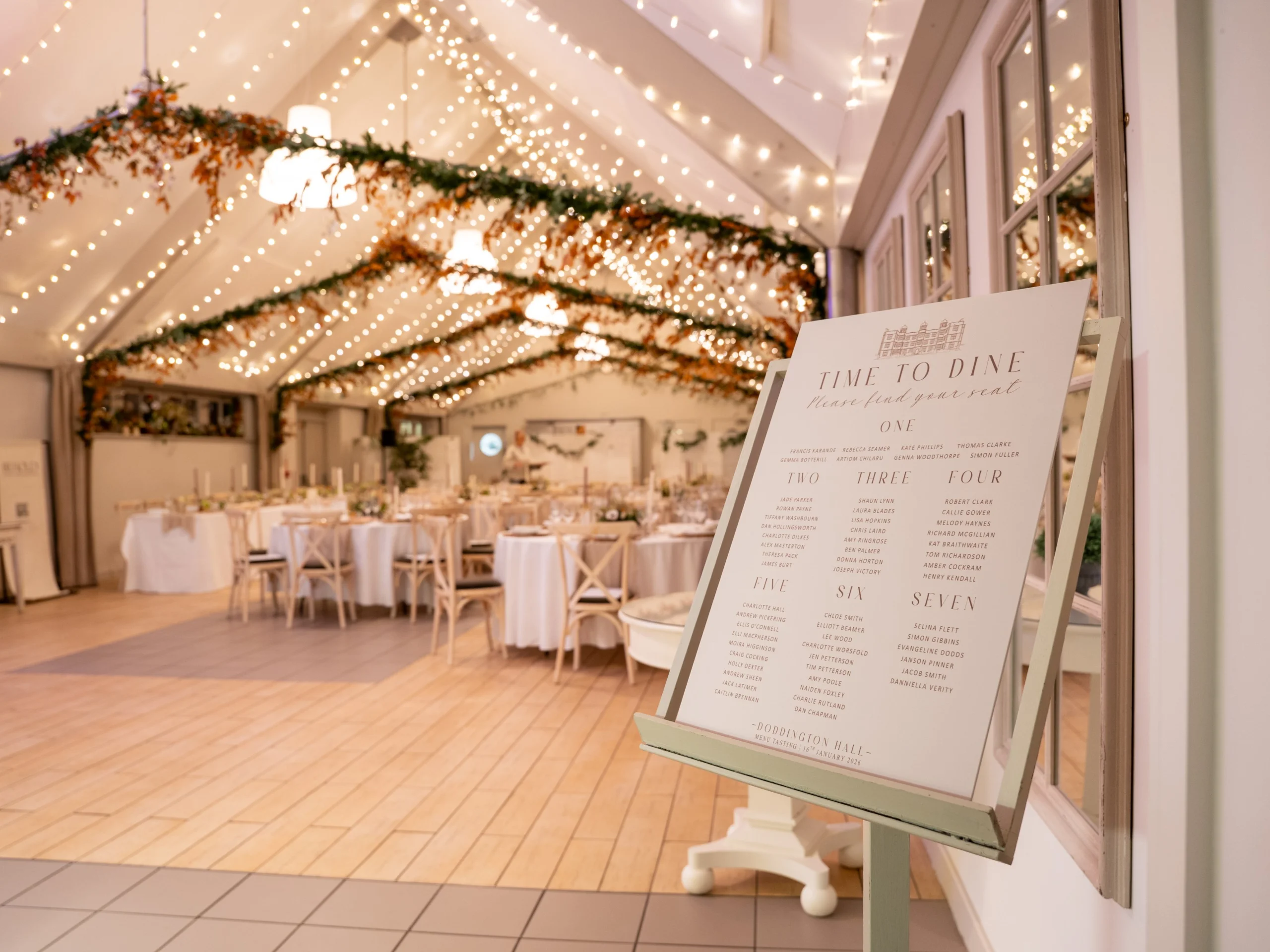 a white wedding seating plan board doddington hall