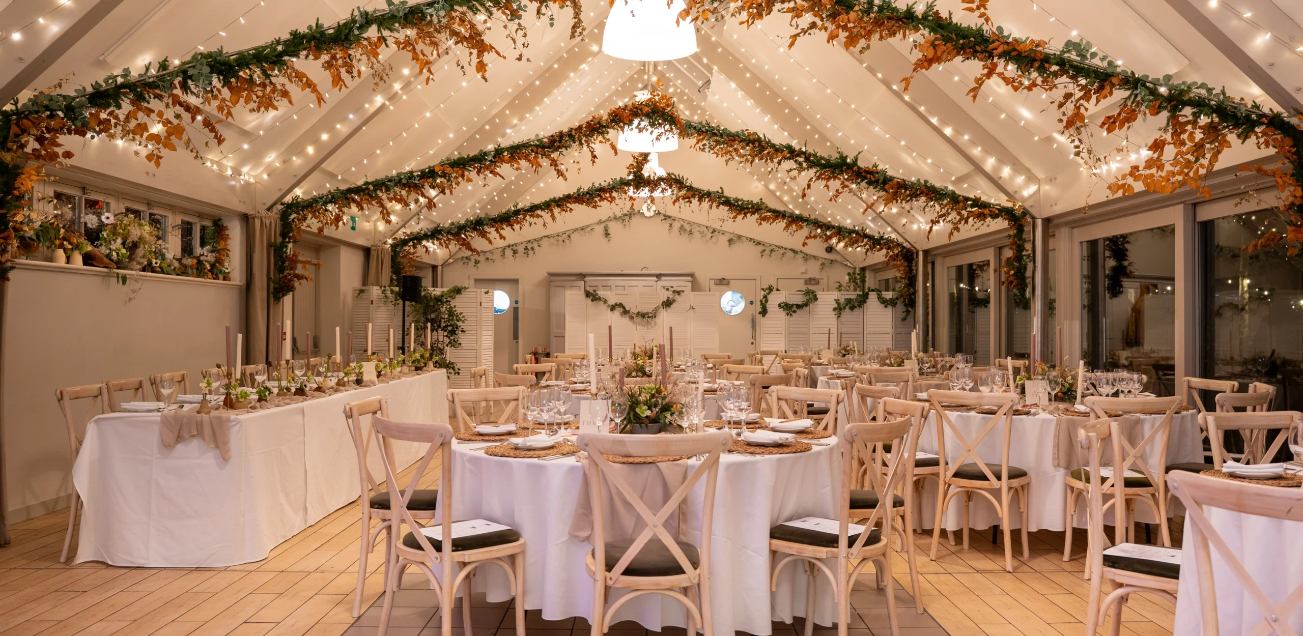 wedding tables setup inside coach house at doddington estate