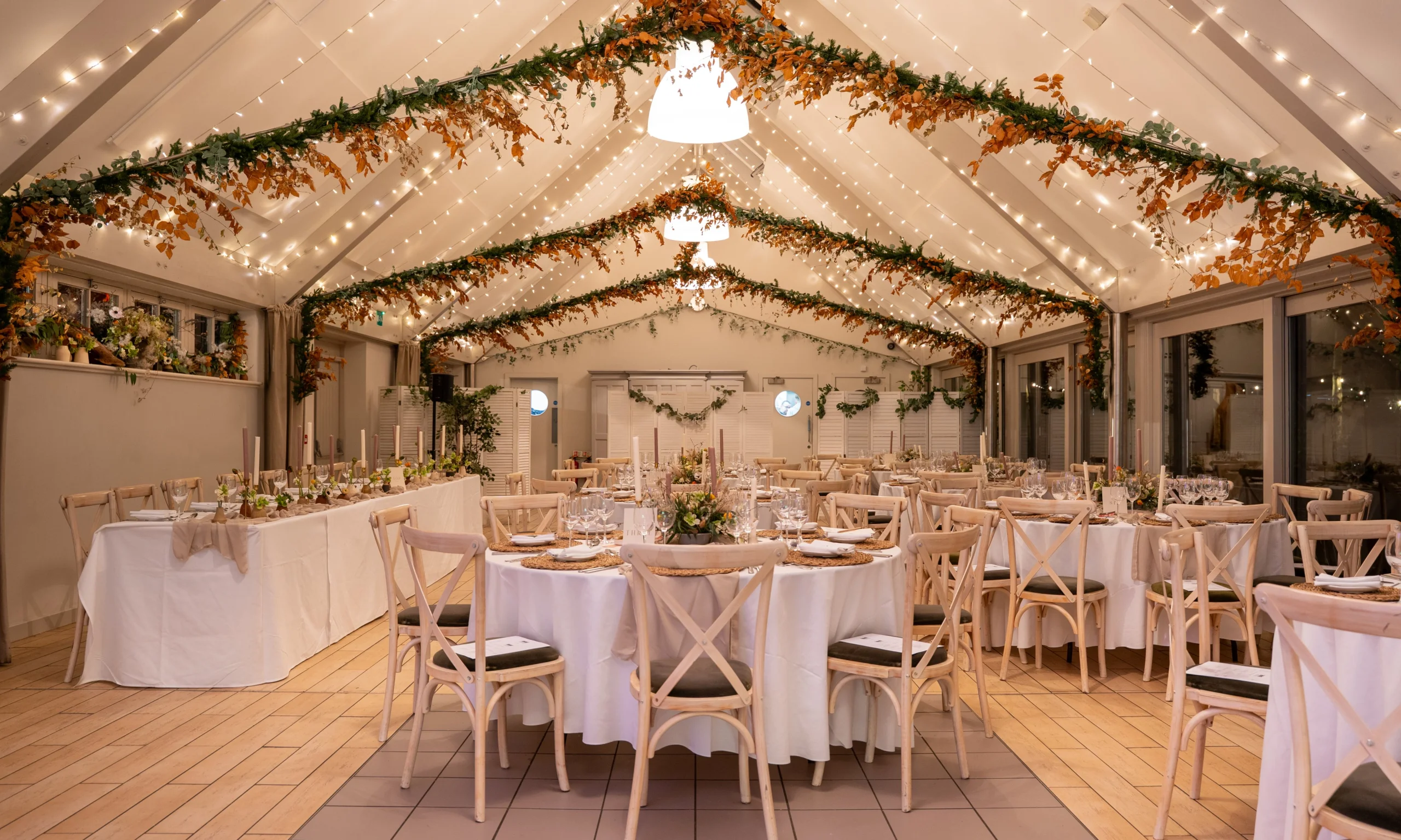 wedding tables setup inside coach house at doddington estate