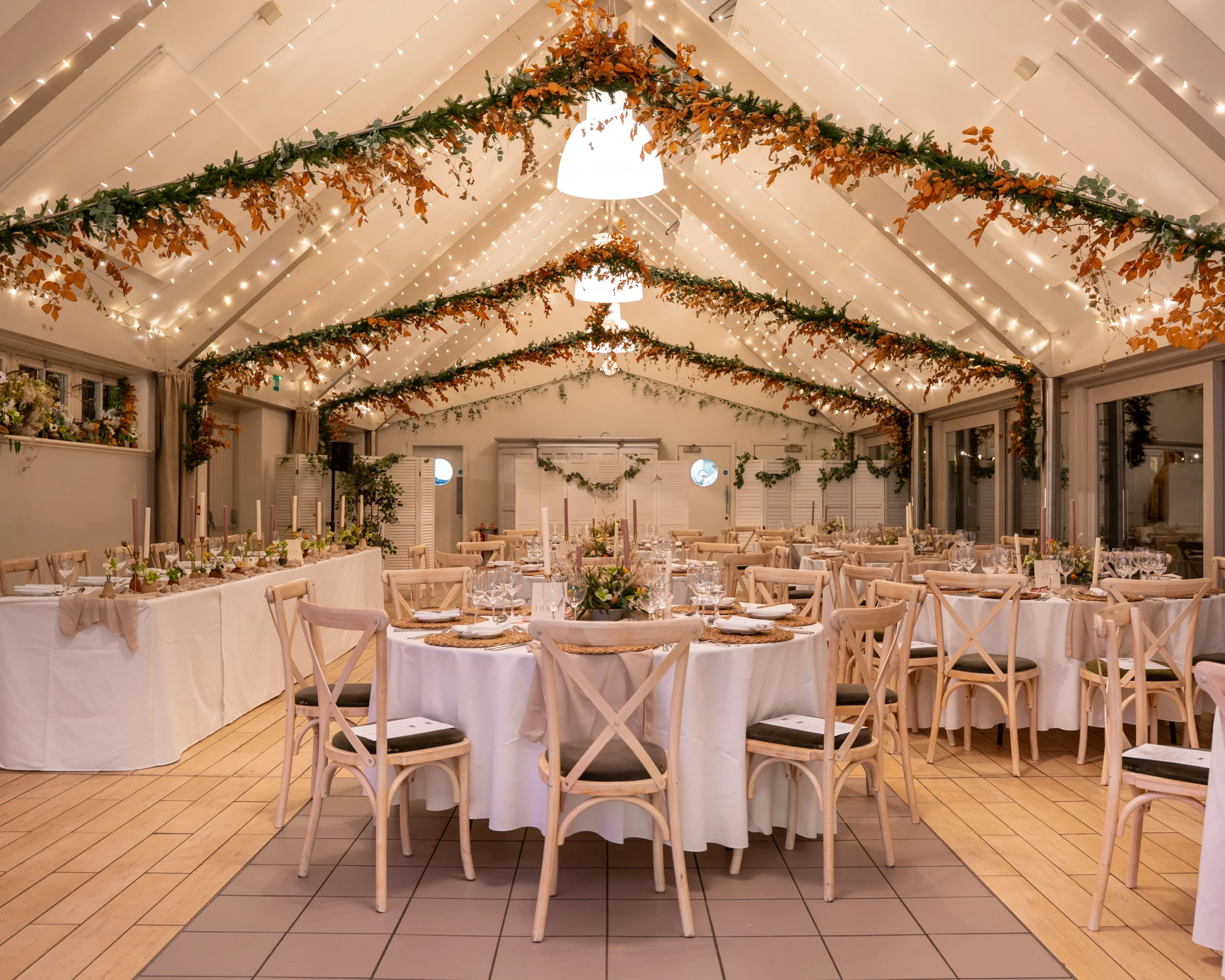 wedding tables setup inside coach house at doddington estate