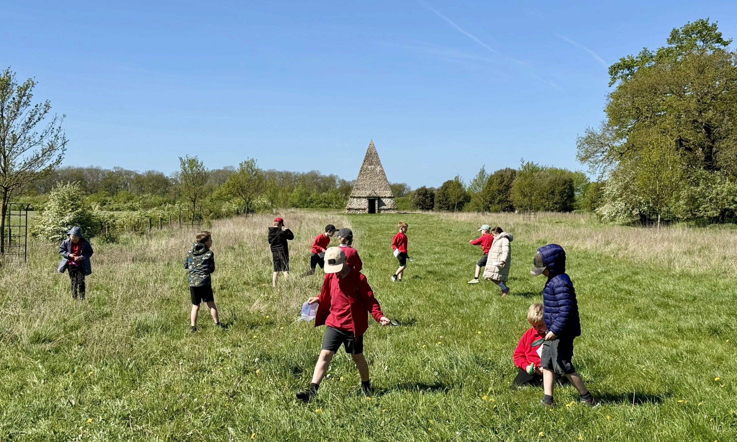 primary school children exploring the grass at wilder doddington