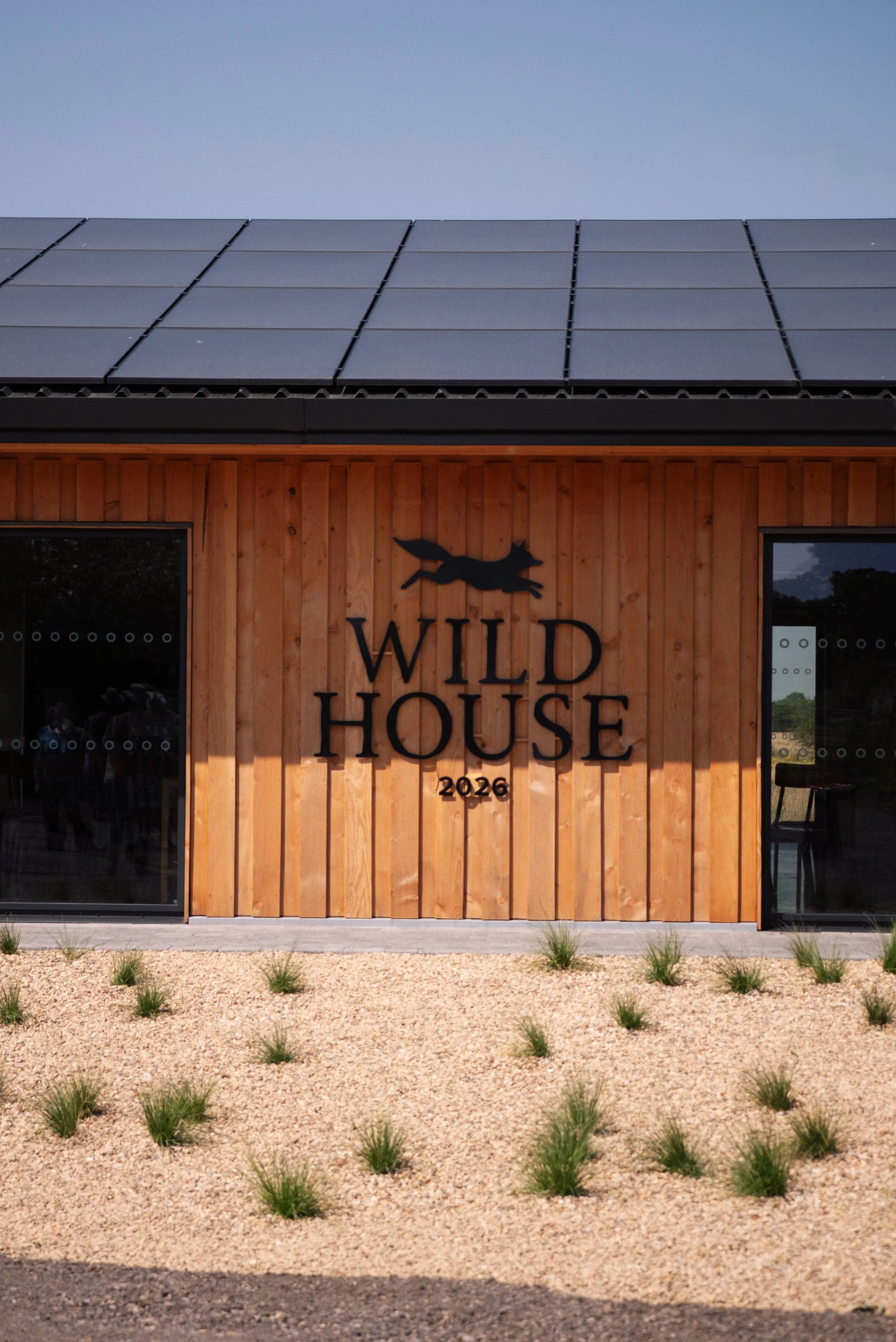 the wild house metal exterior signage