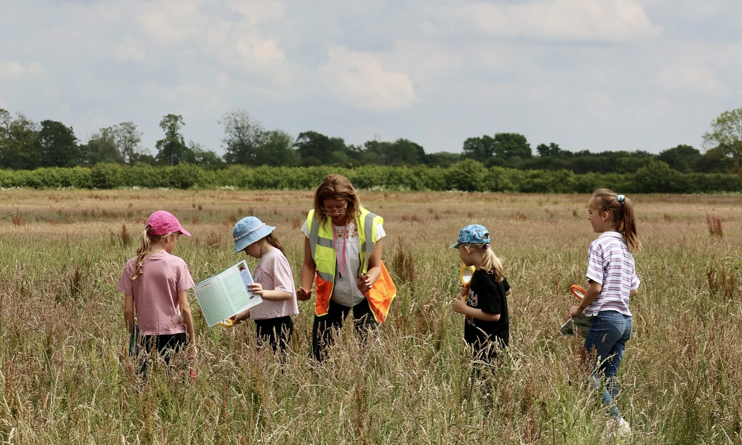 children with a guide exploring the landscape at wilder doddington